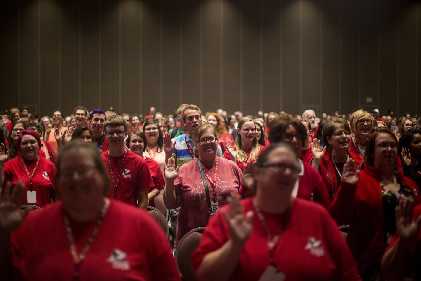 A group of Americorps tutors raised their right hands in 2018 as they took the Americorps pledge. This year's event was held virtually on Zoom.