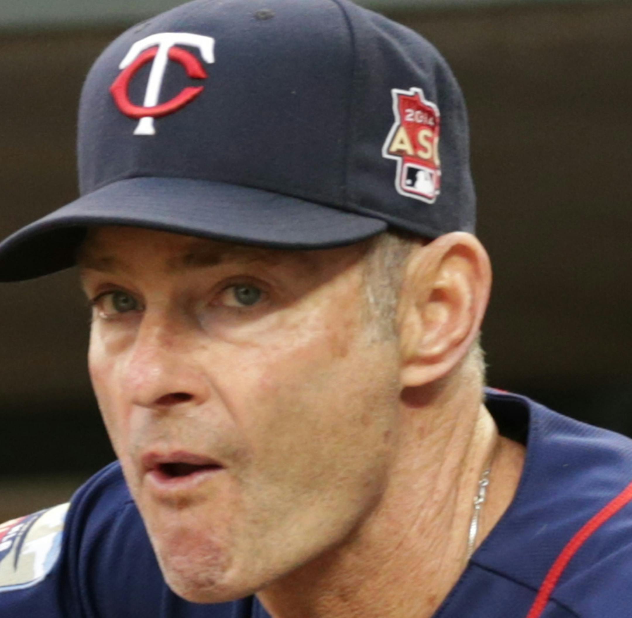 FILE - In this May 27, 2014, file photo, Minnesota Twins coach Paul Molitor watches in the fourth inning of a baseball game against the Texas Rangers in Minneapolis. The Twins say, Monday, nov. 3, 2014, they will hire Molitor as manager after four straight seasons of 92 or more losses. The Twins said the 58-year-old Molitor will be introduced at a news conference Tuesday and given a three-year contract. He replaces Ron Gardenhire, who was fired five weeks ago. (AP Photo/Jim Mone, File)
