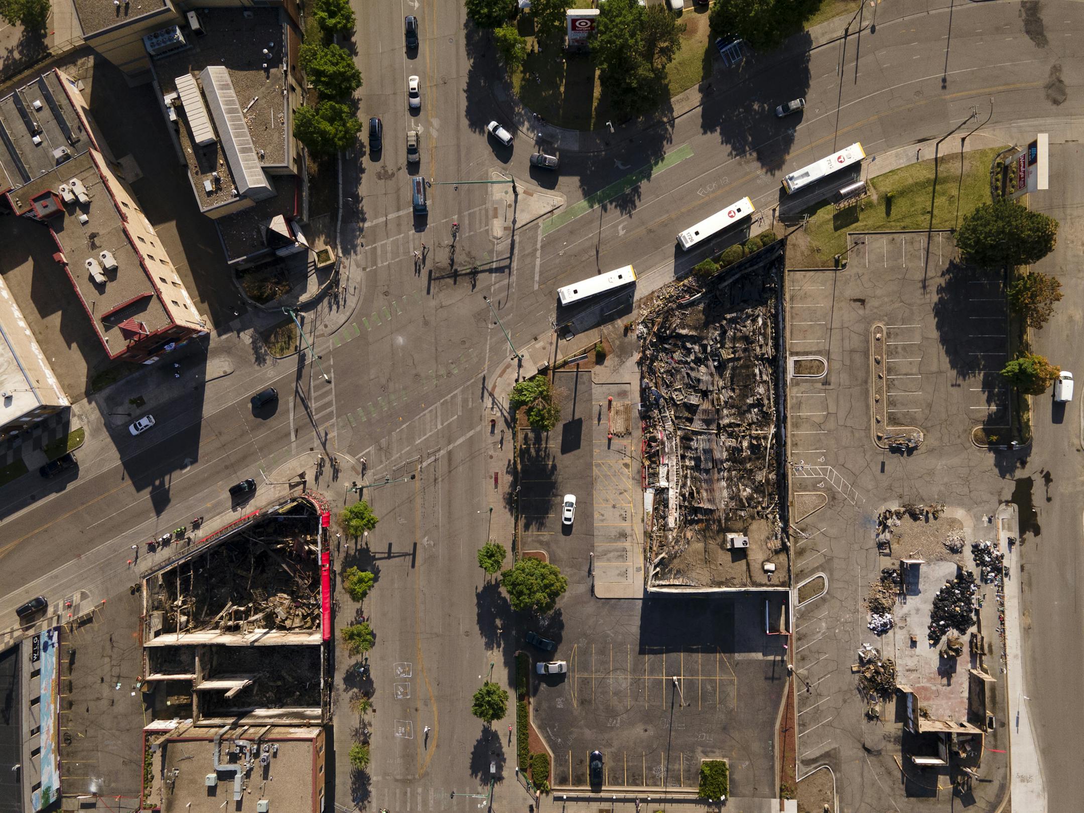 Destroyed buildings at the Minnehaha and Lake intersection across from the Third Precinct, top left. Businesses include Minnehaha Liquors, Wendy's and AutoZone. ] aaron.lavinsky@startribune.com Aerial photos taken Wednesday, June 3, 2020 in the aftermath of the death of George Floyd, who was killed in police custody, in Minneapolis, Minn.