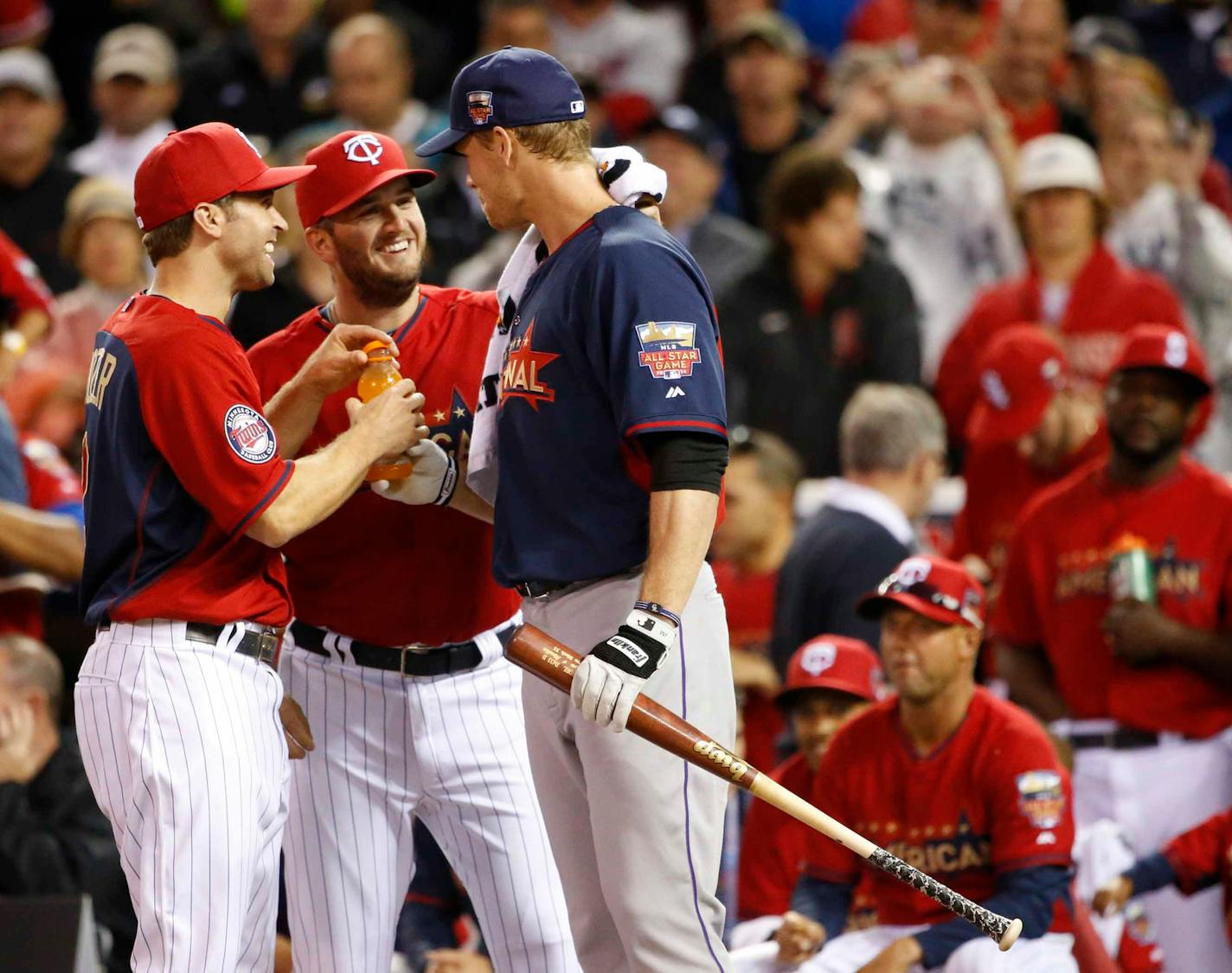 Former twin National League, Justin Morneau, COL gets a little tlc fro the twins player during the All-Star Home Run Derby ] CARLOS GONZALEZ cgonzalez@startribune.com - July 14, 2014 , Minneapolis, Minn., Target Field, All Star Home Run Derby