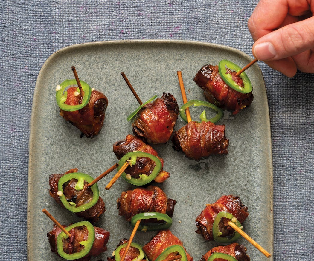 Traditional bacon-wrapped dates meet jalapeño poppers in Jalapeño Bacon-Wrapped Dates from “ScheckEats: Cooking Smarter,” by Jeremy Scheck (Harvest, 2023).