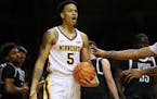 Minnesota Golden Gophers guard Amir Coffey (5) yelled an an official for no calling a foul after he went down while driving to the basket in the secon