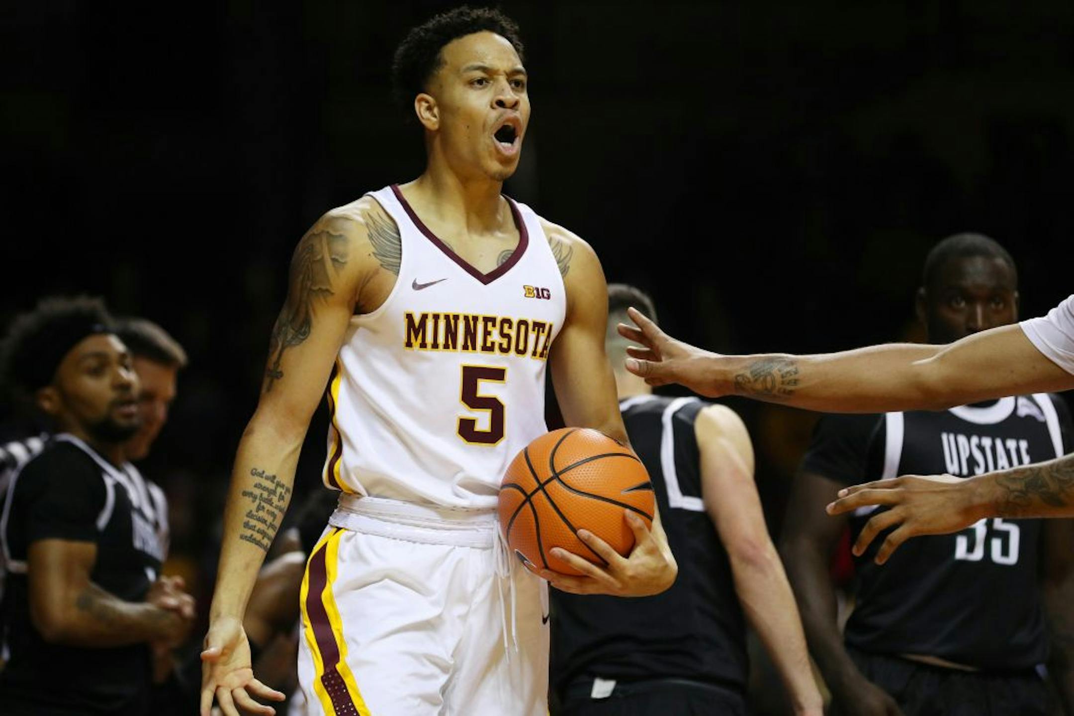 Minnesota Golden Gophers guard Amir Coffey (5) yelled an an official for no calling a foul after he went down while driving to the basket in the second half.