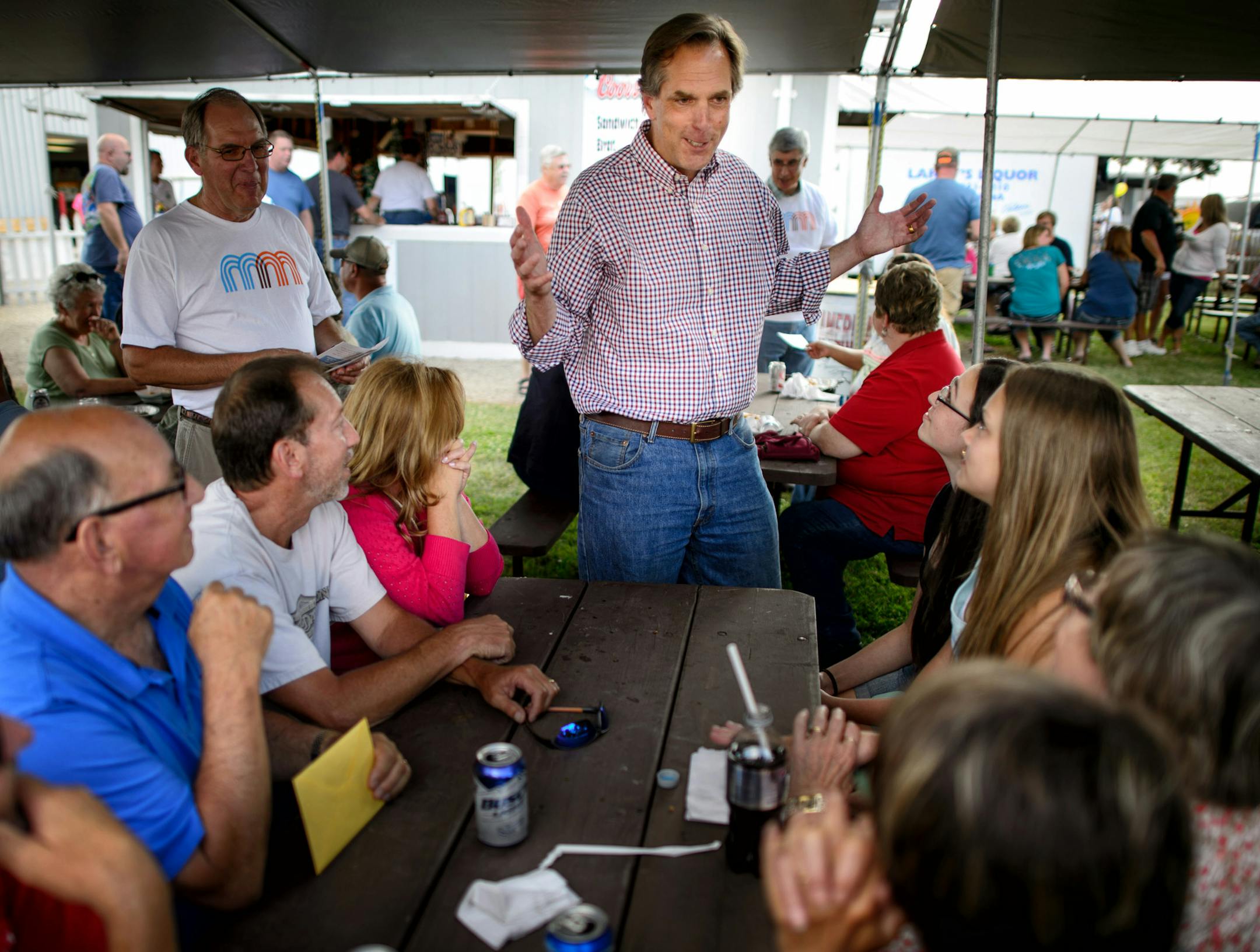 GOP Senate candidate Mike McFadden talked with potential voters in the American Legion area of the Waseca County Free Fair, Wednesday, July 16, 2014. ] GLEN STUBBE * gstubbe@startribune.com