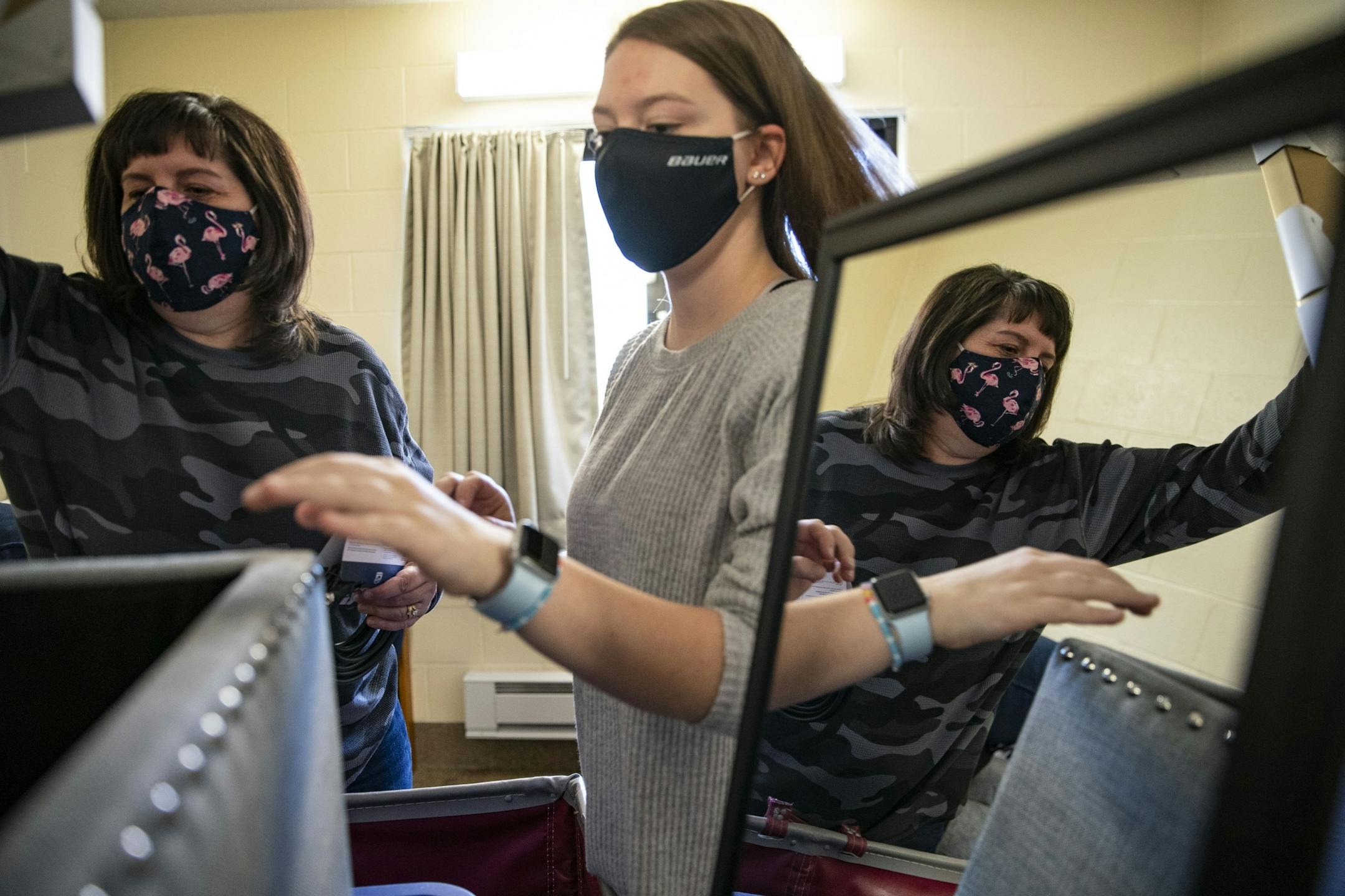 Riley Krenz, an freshman Chemistry major from Rosemount, MN, and her mother, Molly, began unpacking the first of three carts with her belongings as they moved Riley into her room in Ianni Hall at UMD on Thursday.