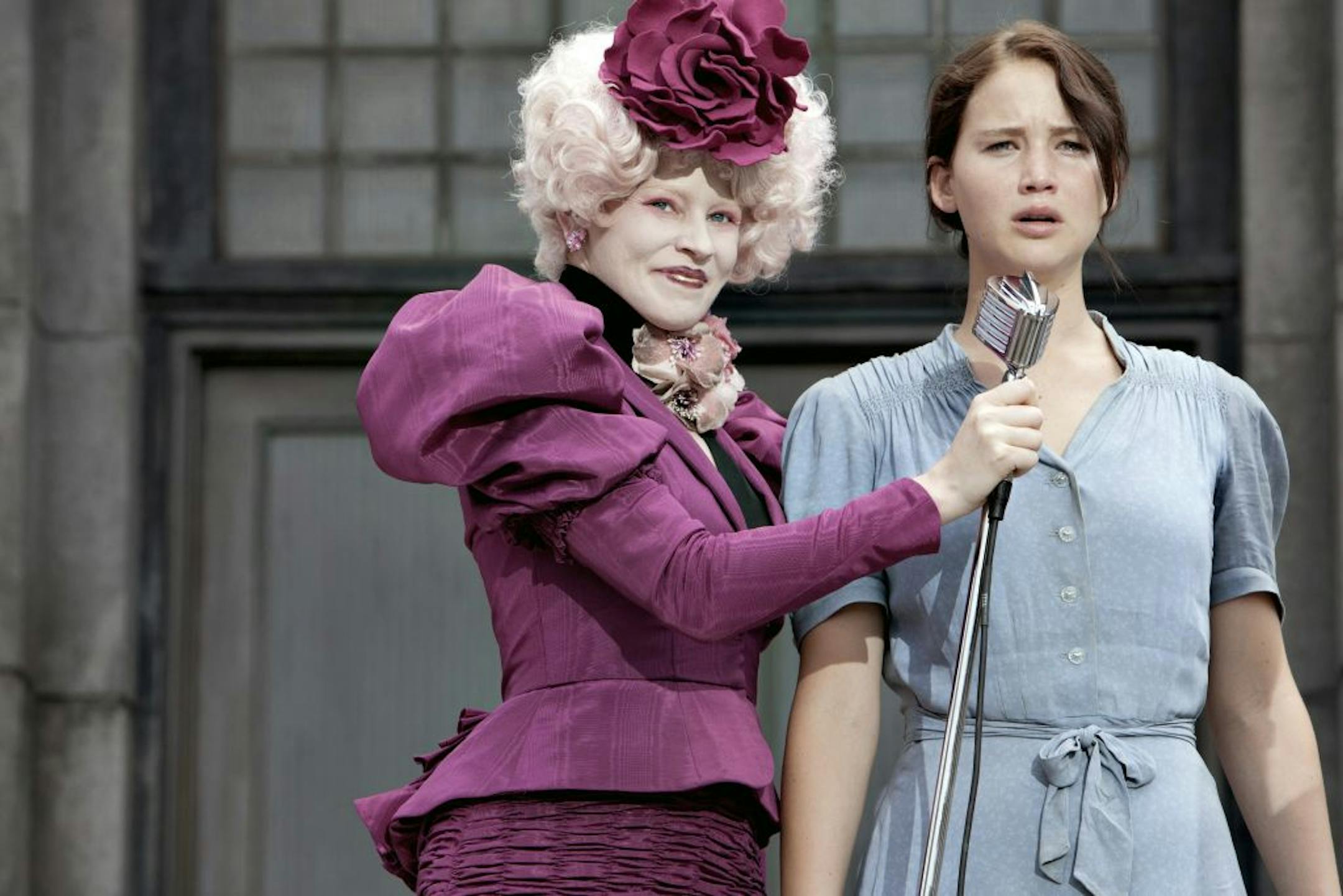 Effie Trinket (Elizabeth Banks, left) and Katniss Everdeen (Jennifer Lawrence) in the movie version of the best-selling book "The Hunger Games."