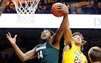 Minnesota's Reggie Lynch, right, tries to knock away a pass to Michigan State's Nick Ward in December.