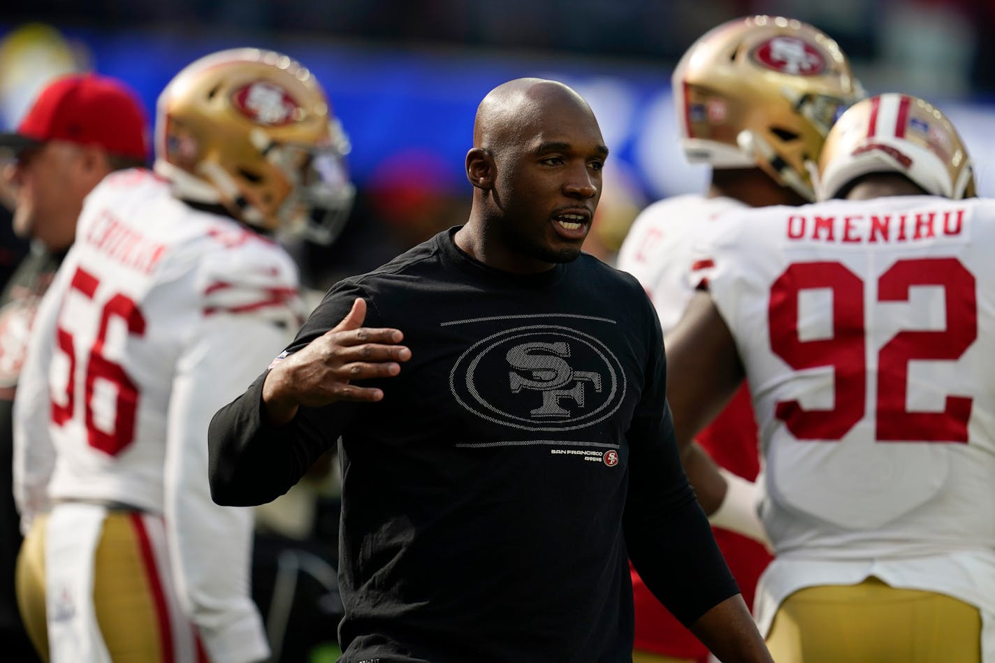 FILE - San Francisco 49ers defensive coordinator DeMeco Ryans greets a player before the team's NFL football game against the Los Angeles Rams on Jan. 9, 2022, in Inglewood, Calif. In Week 3, the 49ers allowed Aaron Rodgers and the Green Bay Packers to drive for the winning field goal in the final 37 seconds. Since then, the Niners have been one of the league's stingiest defenses. The defense for the 49ers is a big reason why the team gets another shot at the Packers in a divisional round playoff game on Saturday night in Green Bay. (AP Photo/Marcio Jose Sanchez, File)