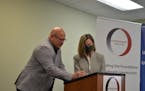 Olmsted County Commissioner Mark Thein, left, and Rochester Mayor Kim Norton signed on Friday a proclamation for the city and county to join the House