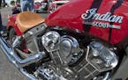 A group of motorcycle fans and potential buyers looked over a batch of Indian motorcycles. ] Indian Motorcycles of the Twin Cities is the 1st dealer i