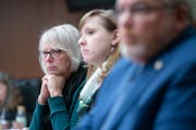Minnesota Representative Liz Reyer listens alongside fellow committee members to testimonies on the End-of-Life Options Act during a hearing in the Mi