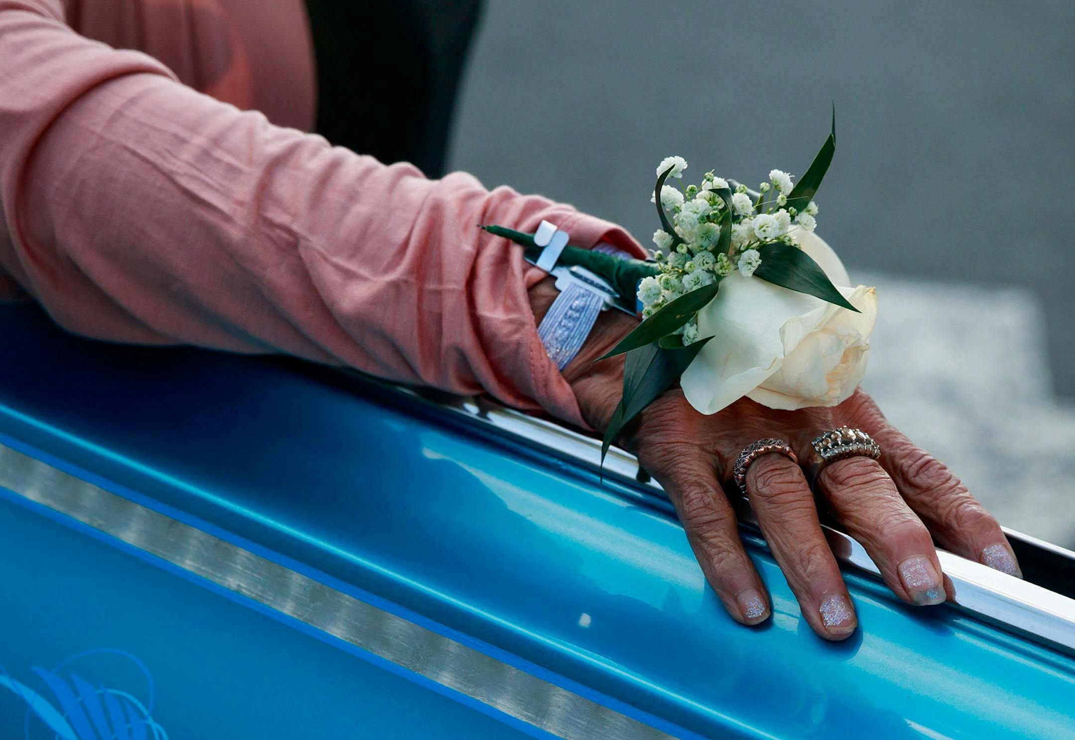 Great-grandmother Marie Antone, 74, wears a corsage at Salty's restaurant in West Seattle on her way to prom. Antone lived in 32 different foster homes while growing up, and was unable to attend her own prom. Her great-grandson Juan "Neeto" Old Chief Betancourt, invited her to his prom to honor her contributions to their family. (Erika Schultz/Seattle Times/TNS)