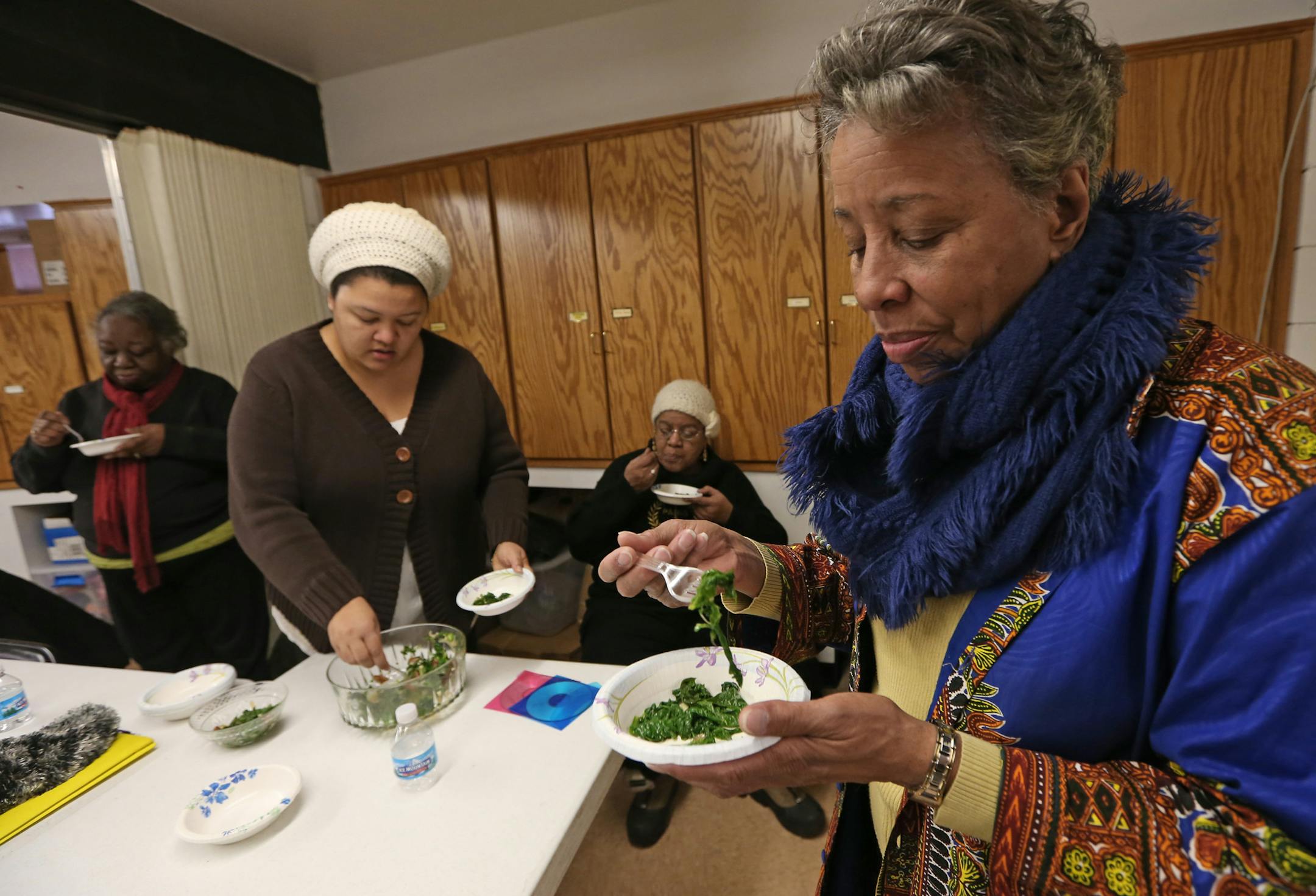 (left to right) Laverna Arnold, Jean Coleman, Regina Tarver and Beverly Propes ate some cooked greens made by Coleman during a health class at the Wayman AME Church on 2/8/14. For years now, Beverly Propes has been on a mission to help her North Minneapolis community get healthy. Every Sunday morning, she's at church checking people's blood pressure and chatting them up about their diet and exercise habits - or lack thereof, depending on what the numbers tell her. She's out to share with them th