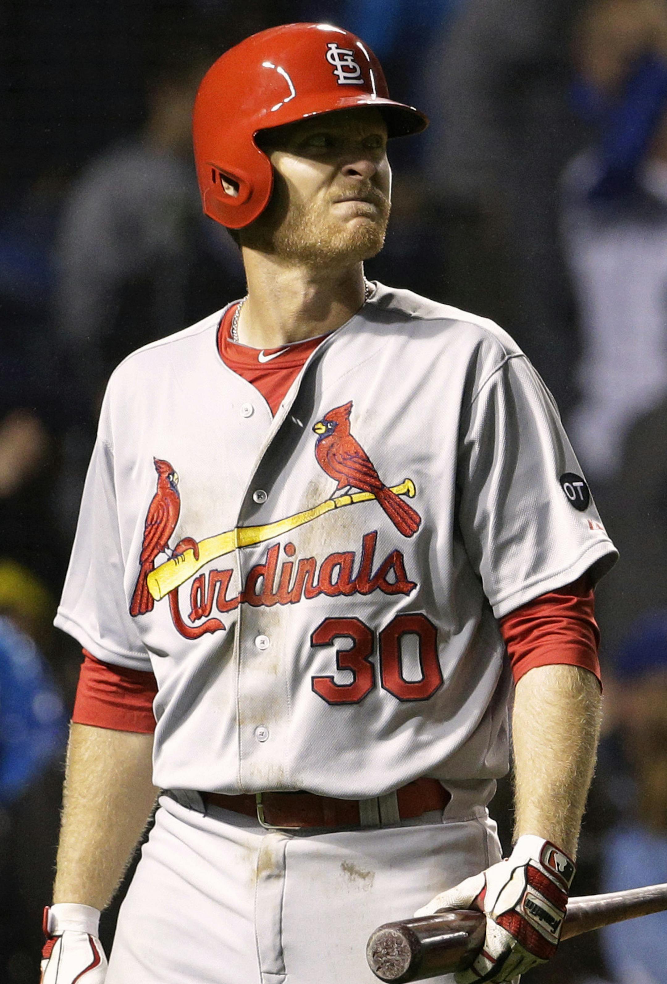 St. Louis Cardinals' Dan Johnson reacts after striking out swinging during the eighth inning of a baseball game against the Chicago Cubs Wednesday, July 8, 2015, in Chicago. (AP Photo/Nam Y. Huh) ORG XMIT: CXC120
