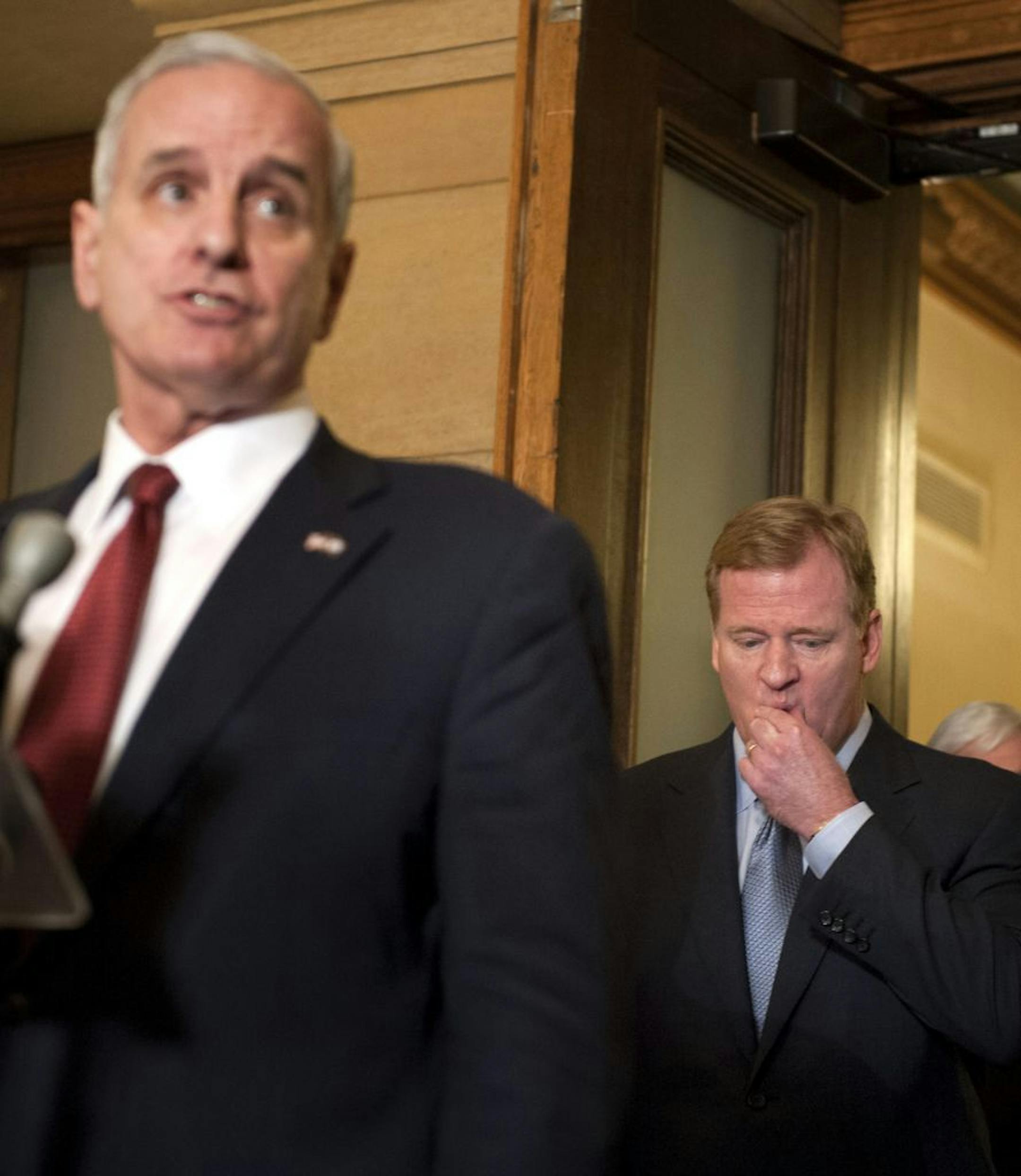 NFL commissioner Roger Goodell, right, listened as Governor Mark Dayton spoke to the media after they met at the Capitol to discuss the Vikings stadium. Friday, April 20, 2012.