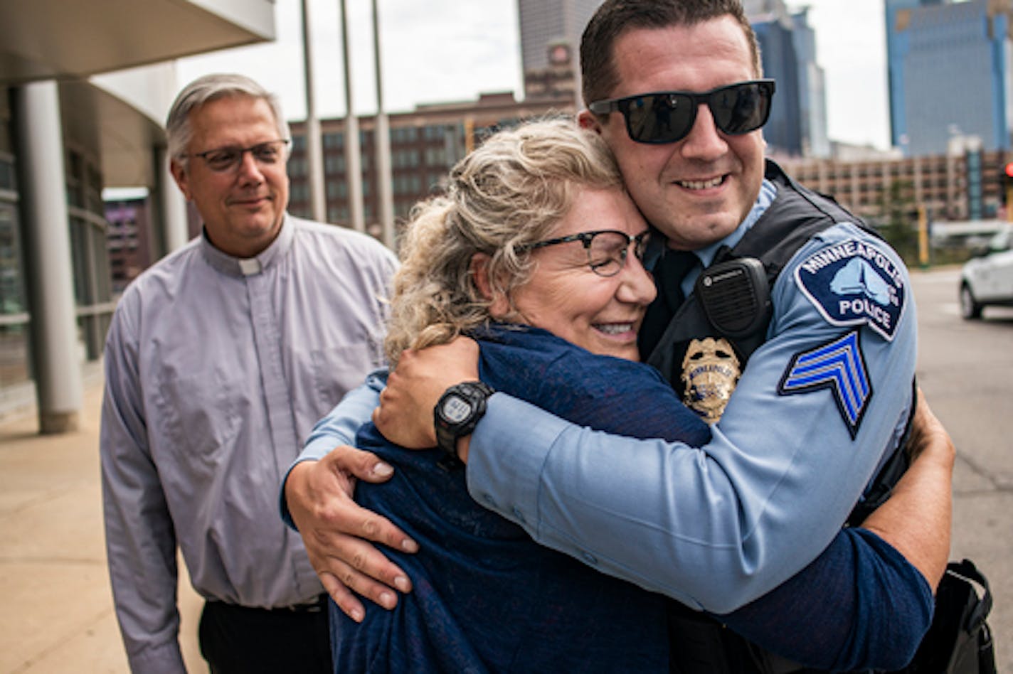 Tina Wagner hugged her son Minneapolis police Sgt. Andrew Schroeder, who was honored with the department's Medal of Valor Wednesday for pulling the most-used gun off the streets of Minneapolis last year.