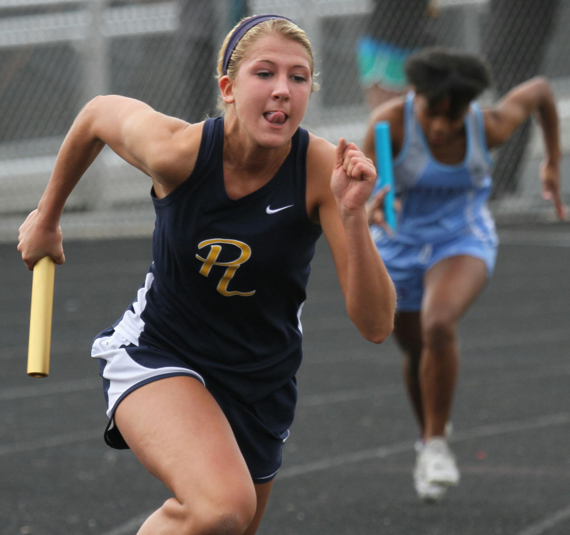 (left) Alex Collins of the Prior Lake High School Track Team 4 X 200 relay event, took off on the first leg of the event during competition at the school on 4/30/13. Bruce Bruce Bisping/Star Tribune Alex Collins/source