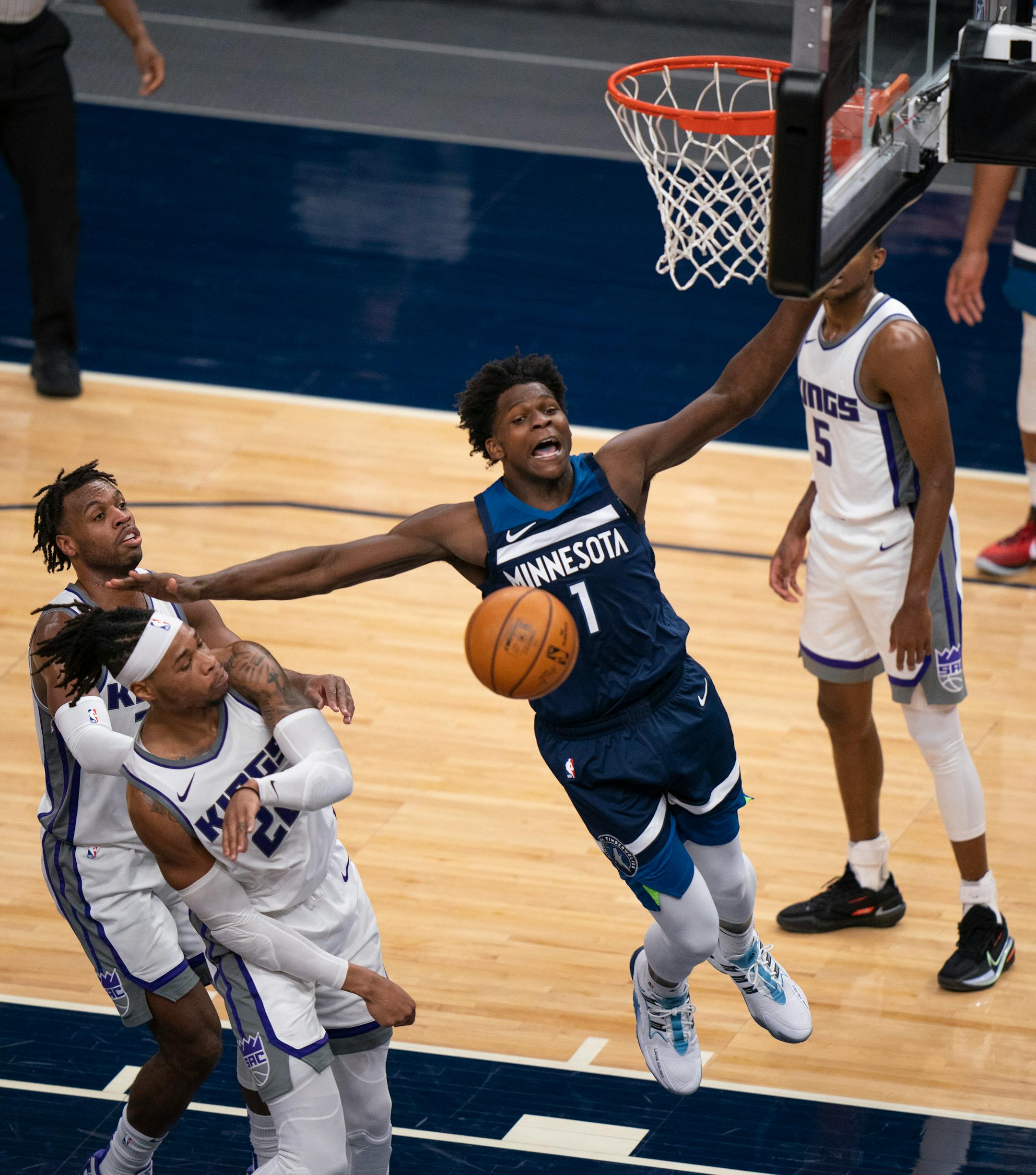 Minnesota Timberwolves forward Anthony Edwards (1) was fouled by Sacramento Kings center Richaun Holmes (22) in the third quarter.