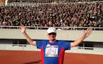 Lowell Thompson, 78, of New Brighton, before the cheering fans at Kim Il-sung Stadium, in Pyongyang, North Korea, where Thompson ran a 10K race on Apr