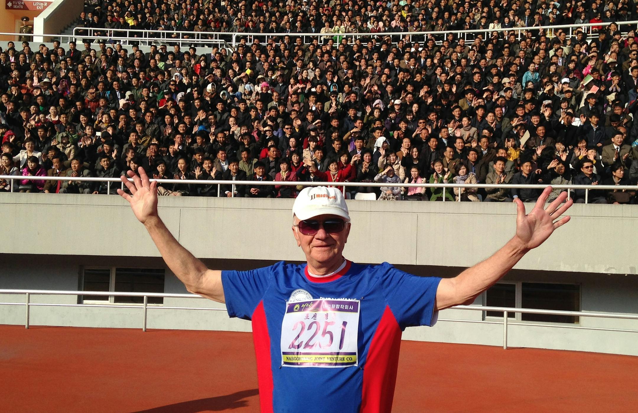 Lowell Thompson, 78, of New Brighton, before the cheering fans at Kim Il-sung Stadium, in Pyongyang, North Korea, where Thompson ran a 10K race on April 9.
