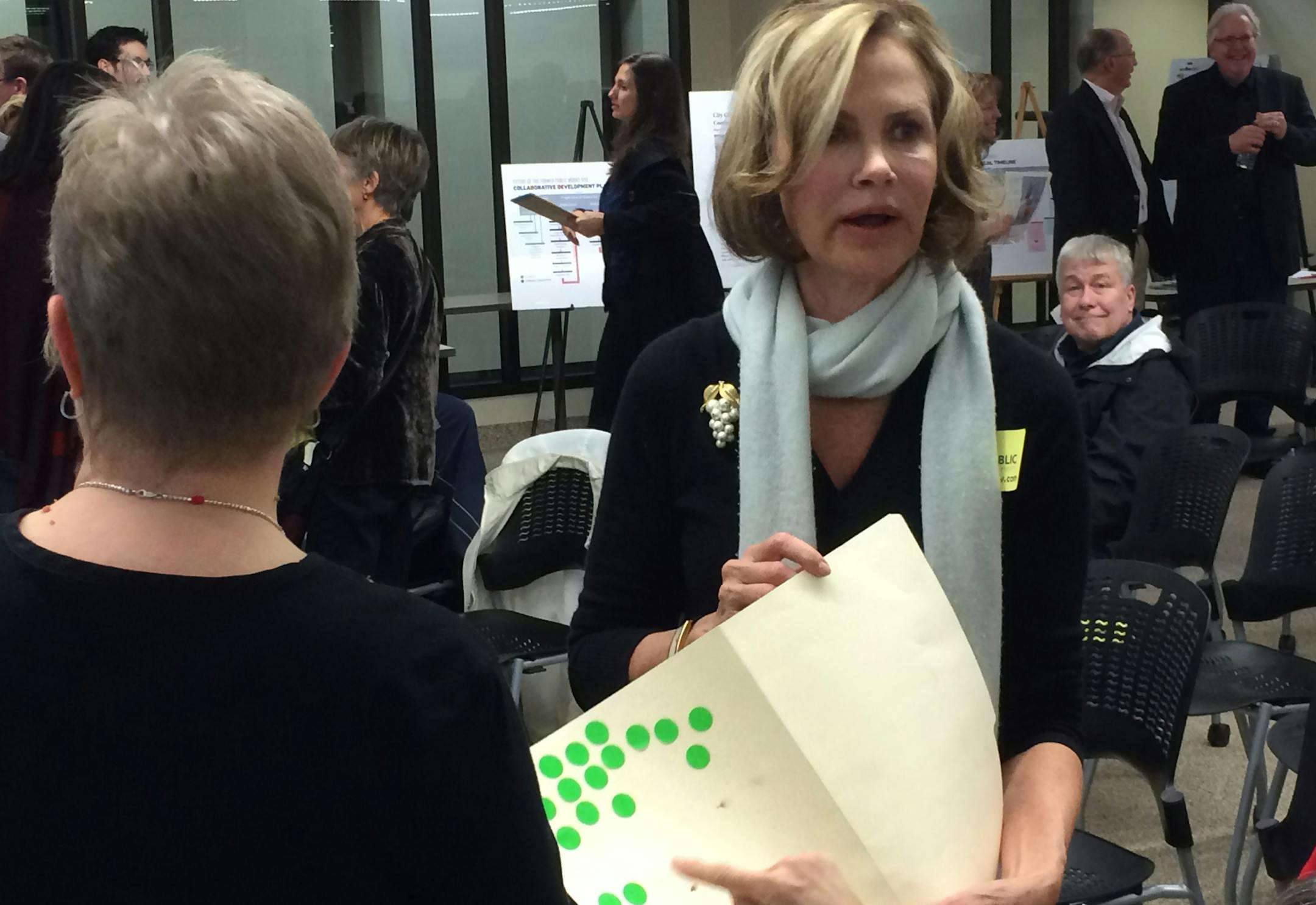 Kim Montgomery, an opponent of Edina's proposed Grandview development, collects votes against the project at a public meeting Wednesday night. ] John Reinan &#xef; Star Tribune