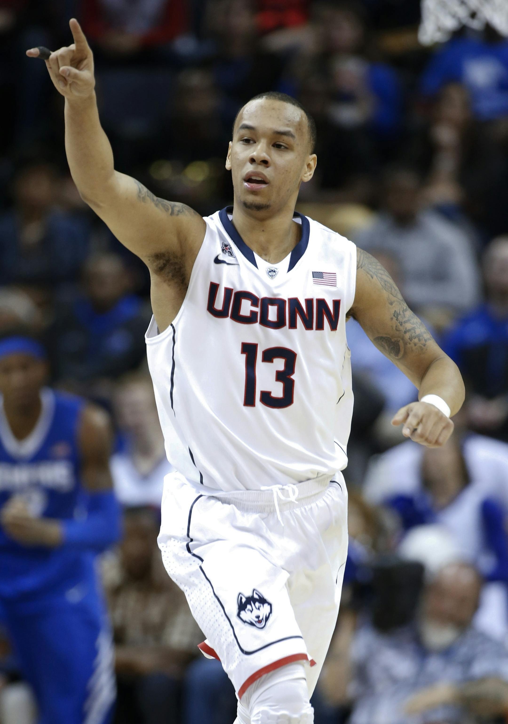 Connecticut guard Shabazz Napier celebrates a score against Memphis during the first half of an NCAA college basketball game in the quarterfinals of the American Athletic Conference men's tournament Thursday, March 13, 2014, in Memphis, Tenn. (AP Photo/Mark Humphrey)