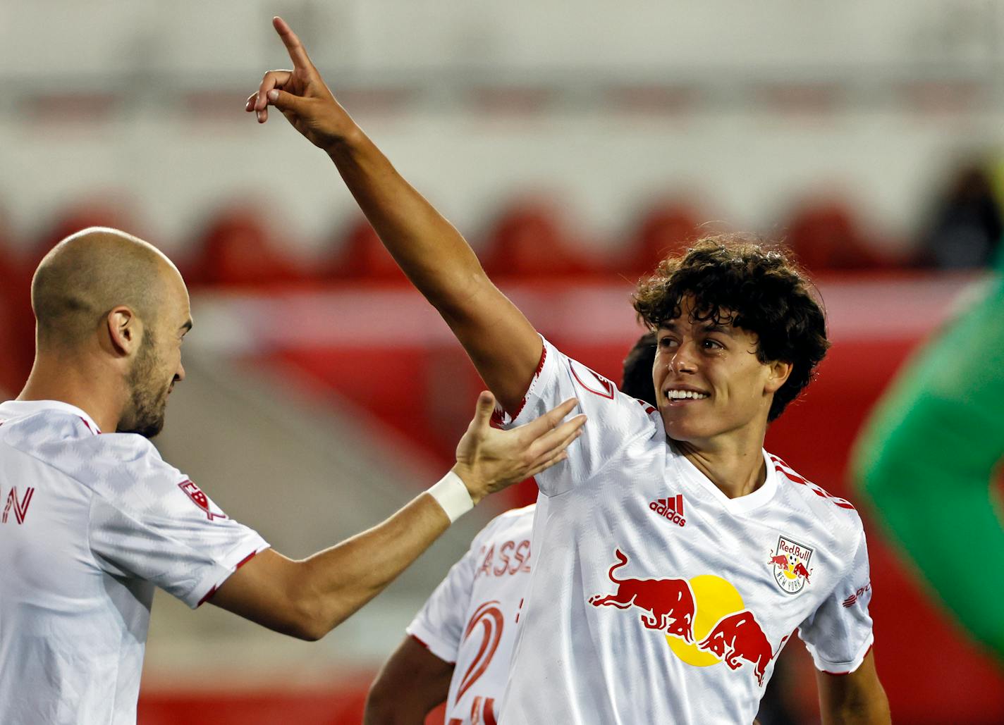 FILE - In this Saturday, April 17, 2021 file photo, New York Red Bulls midfielder Caden Clark (37) reacts after scoring a goal against the Sporting Kansas City during an MLS soccer match in Harrison, N.J. The New York Red Bulls are emblematic of a growing youth movement in Major League Soccer. The team has one of the most talked-about young players in the league, 17-year-old Caden Clark. A native Minnesotan, has three goals already this season for the Red Bulls. (AP Photo/Adam Hunger, File)