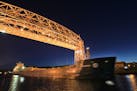 File photo: A freighter sails under the Lift Bridge in Duluth, Minn., in a June 2012 file image. (Tom Wallace/Minneapolis Star Tribune/TNS)