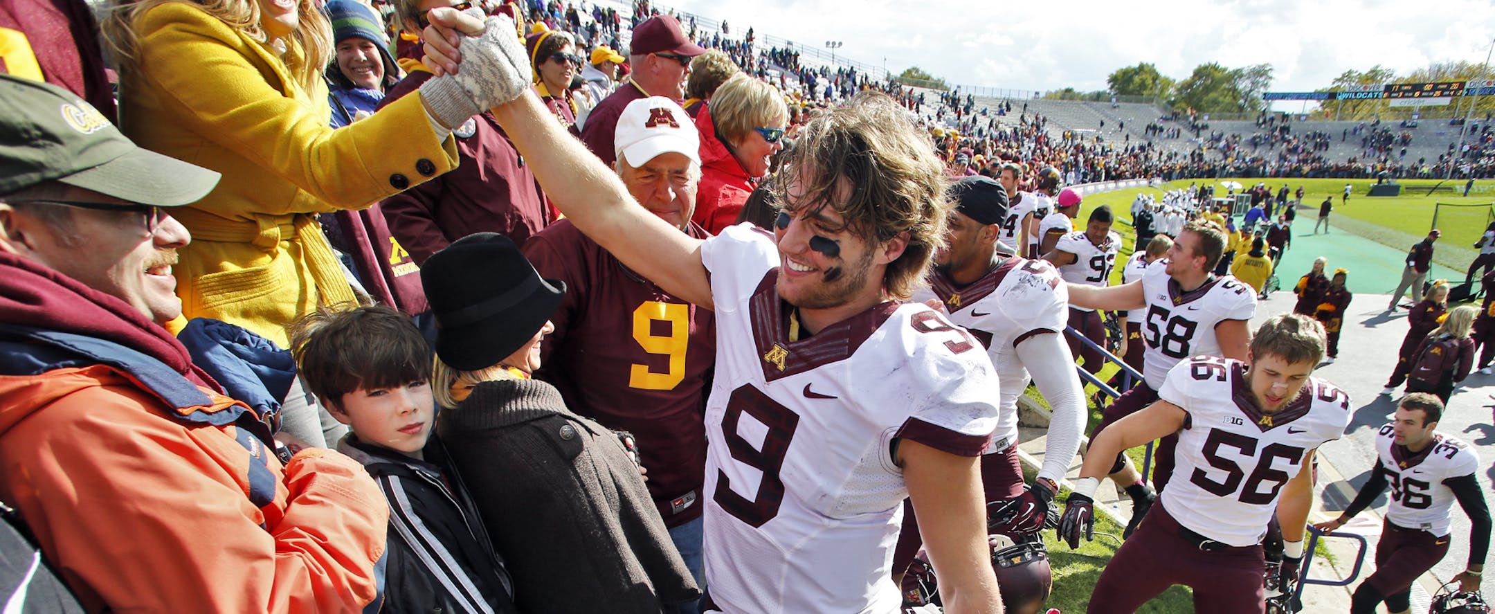 Minnesota Gophers vs. Northwestern Wildcats football. Minnesota won 20-17. Gophers quarterback Philip Nelson (9) accepted congratulations from Minnesota fans at the end of the game. . (MARLIN LEVISON/STARTRIBUNE(mlevison@startribune.com)