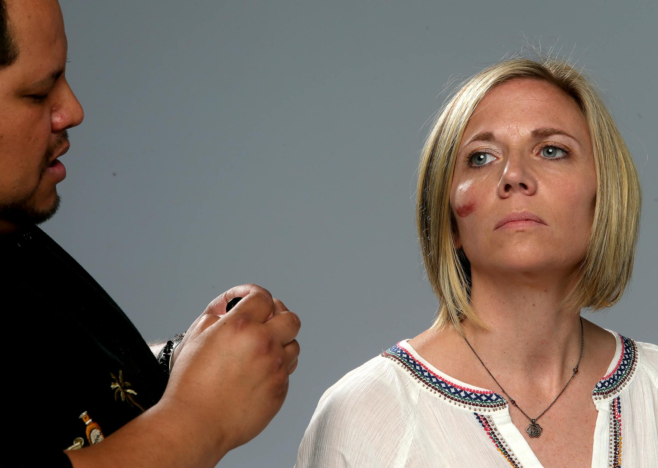 Mark Navarro works on Katie Jordan's cheeks. ] JOELKOYAMA‚Ä¢jkoyama@startribune Minneapolis, MN on June 10, 2014. Artist Mark Navarro is bringing the makeup and models and we'll photograph three segments.