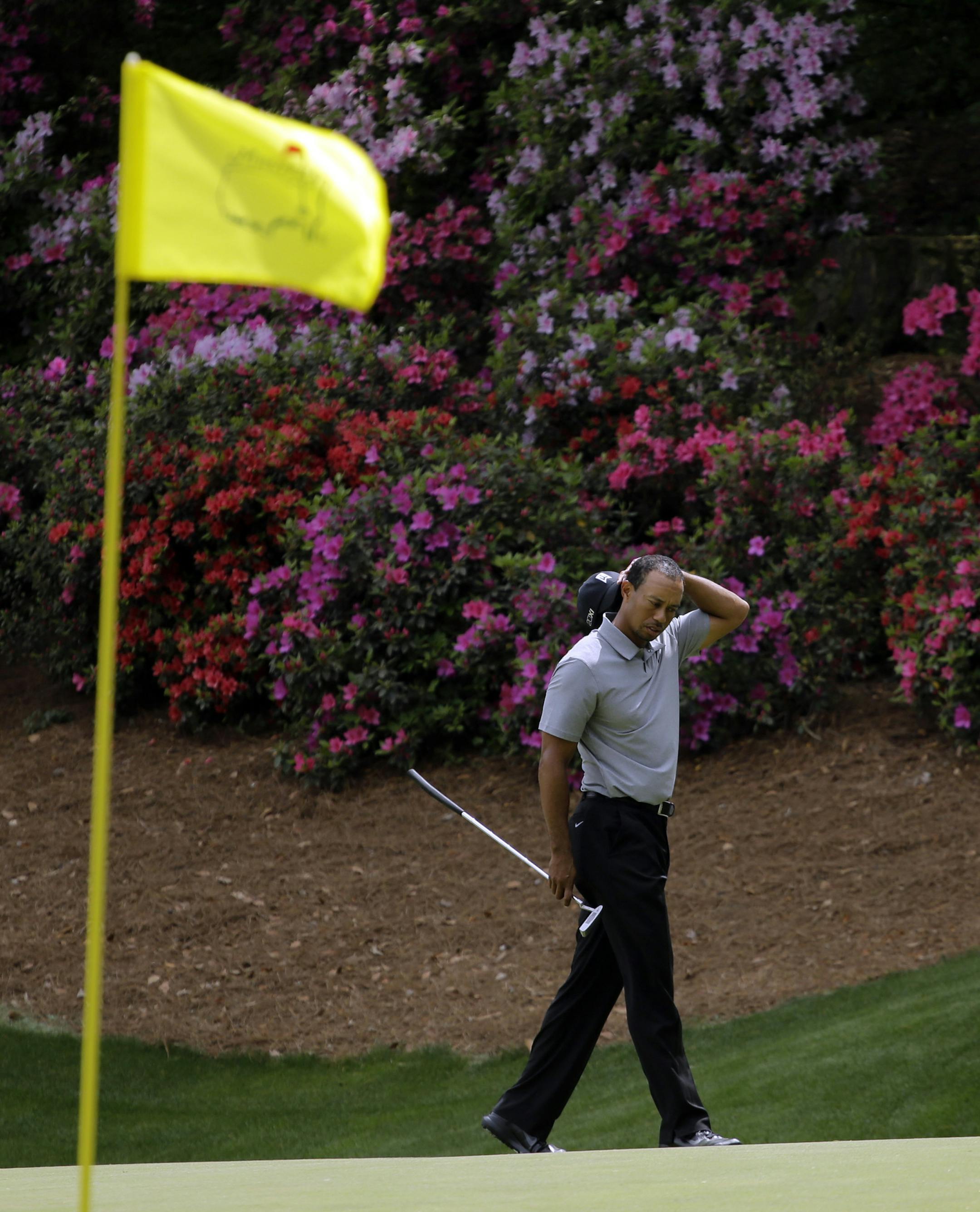 Tiger Woods waits to putt on the 13th green during the first round of the Masters golf tournament Thursday, April 11, 2013, in Augusta, Ga. (AP Photo/Matt Slocum)