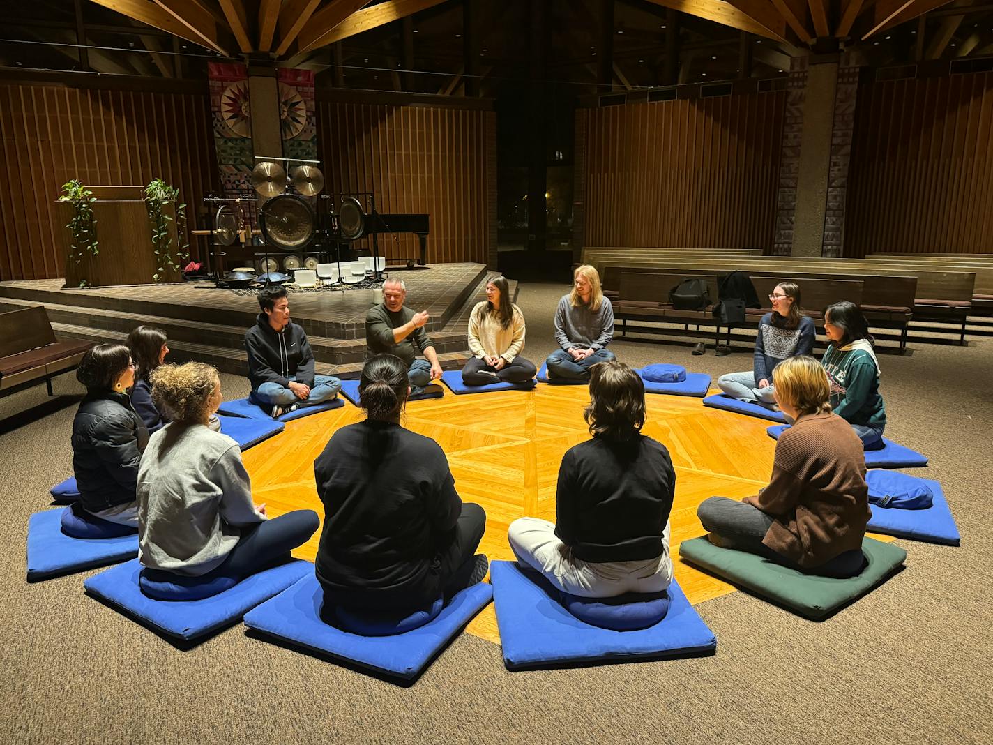 Students in the Anthropology of Death and Dying class sit in a circle discussing their experiences in hospices.