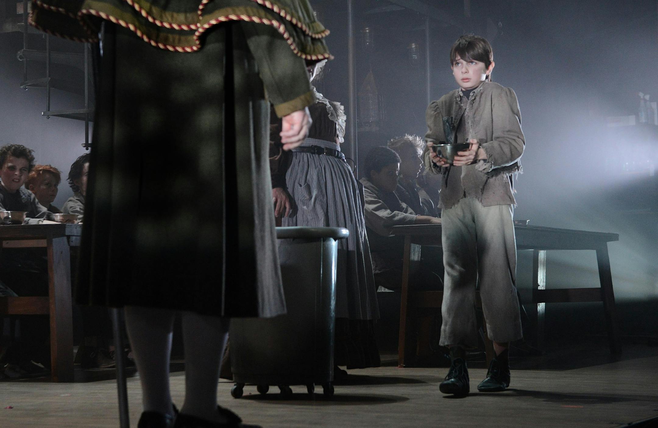 Oliver, played by Nate Turcotte, asks for more food during a rehearsal of "Oliver!"