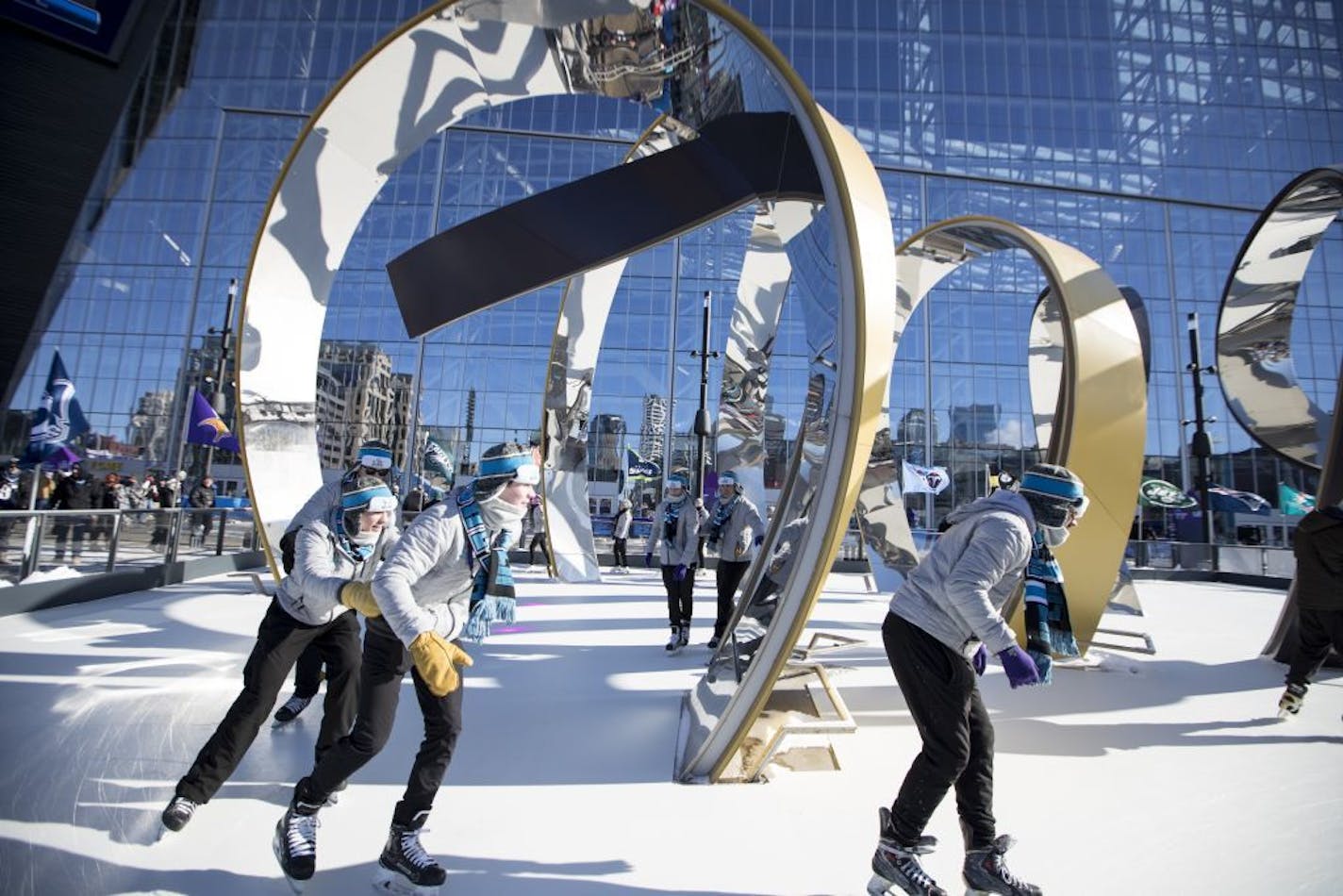 Ice skaters skated around a rink set up outside of U.S. Bank Stadium before Super Bowl LII on Sunday, February 4, 2018, in Minneapolis, Minn.