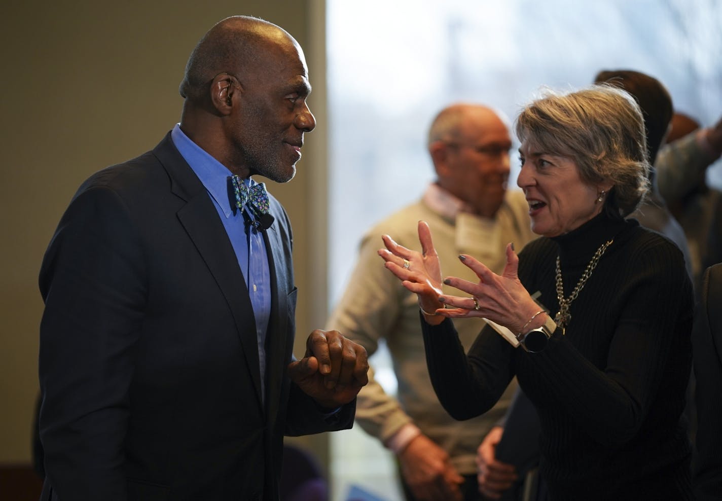 Between panel discussions, Former Supreme Court Justice Alan Page visited with Sue Riesgraf of the Banyan Community.