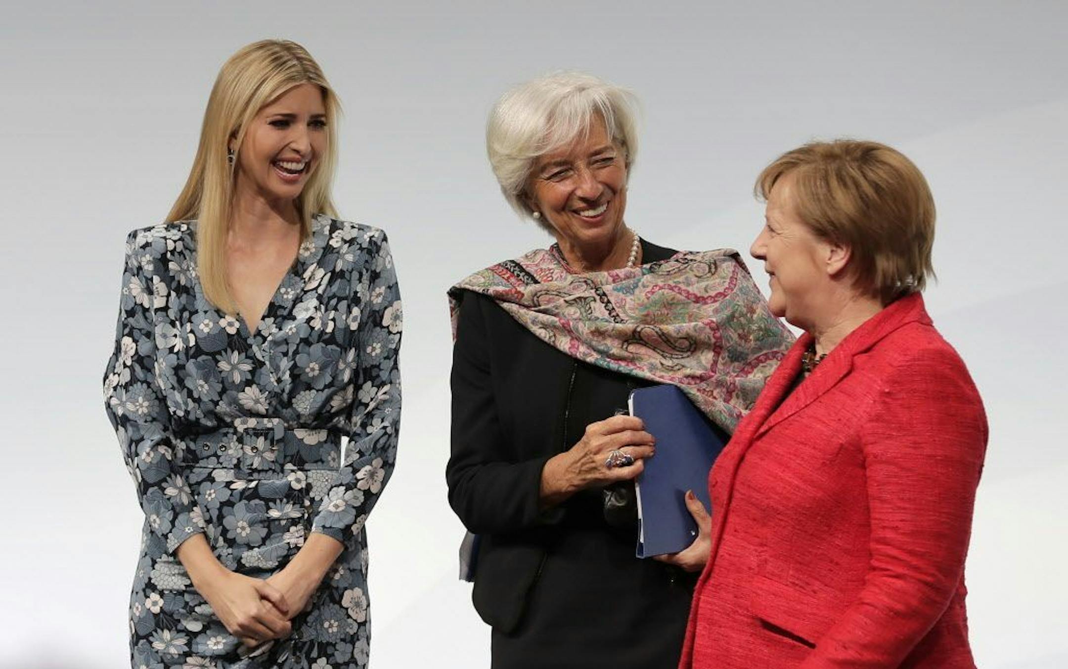 Ivanka Trump, daughter and adviser of U.S. President Donald Trump, International Monetary Fund Managing Director Christine Lagarde and German Chancellor Angela Merkel, from left, chat after a panel at the W20 Summit in Berlin Tuesday, April 25, 2017. The conference aims at building support for investment in women's economic empowerment programs.