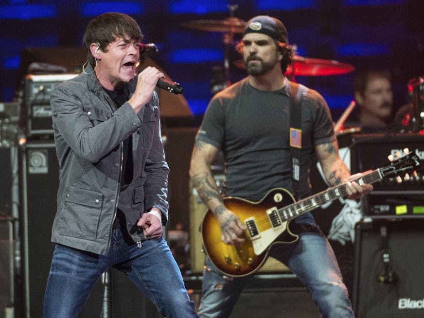 Chris Henderson, left, and Brad Arnold of 3 Doors Down perform at Charlie Daniels 80th Birthday Volunteer Jam at Bridgestone Arena on Wednesday, Nov, 30, 2016, in Nashville, Tenn. (Photo by Amy Harris/Invision/AP) ORG XMIT: INVW