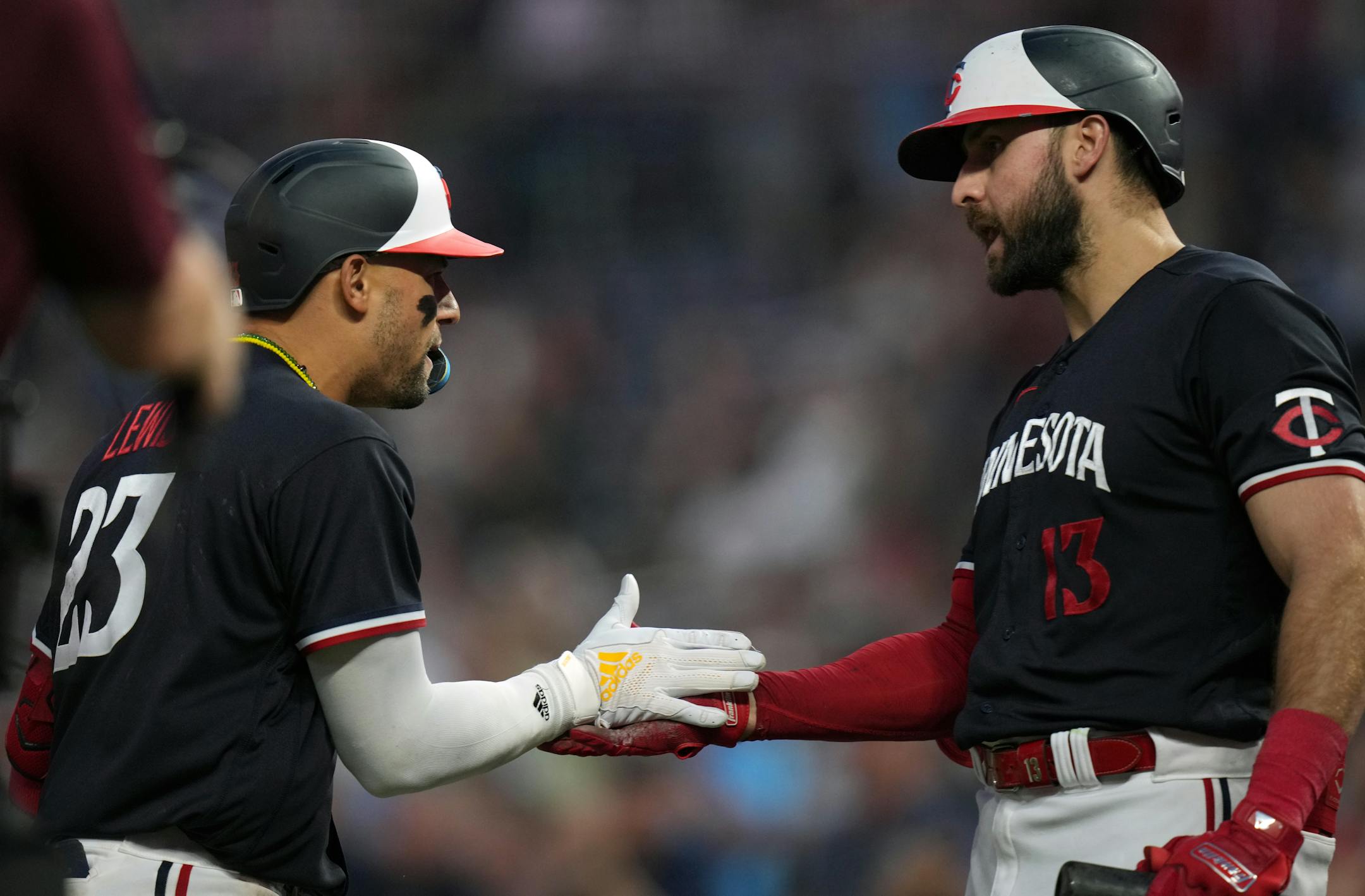Minnesota Twins third baseman Royce Lewis (23) is congratulated by Minnesota Twins first baseman Joey Gallo (13) after homering in the 8th in Minneapolis, Minn., on Thursday, June 1, 2023.