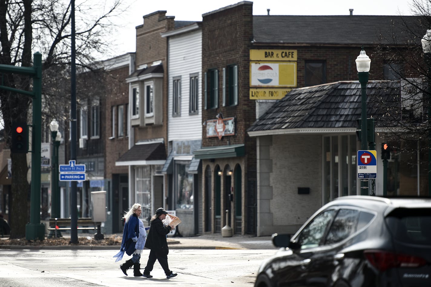 Katie and Merle Jarvis, of St. Paul, crossed 7th Avenue East with their haul from an afternoon of antiquing Wednesday in North St. Paul. Katie says she's been coming to the city's car show for years. ] Aaron Lavinsky ¥ aaron.lavinsky@startribune.com