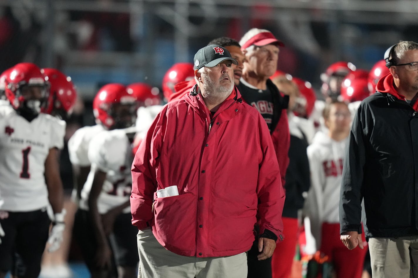 E.P. head coach Mike Grant keeps an eye on the game in Minnetonka, Minn., on Thursday, Oct. 5, 2023. The Eden Prairie football team takes on Minnetonka at Minnetonka H.S. RICHARD TSONG-TAATARII • richard.tsong-taatarii @startribune.com