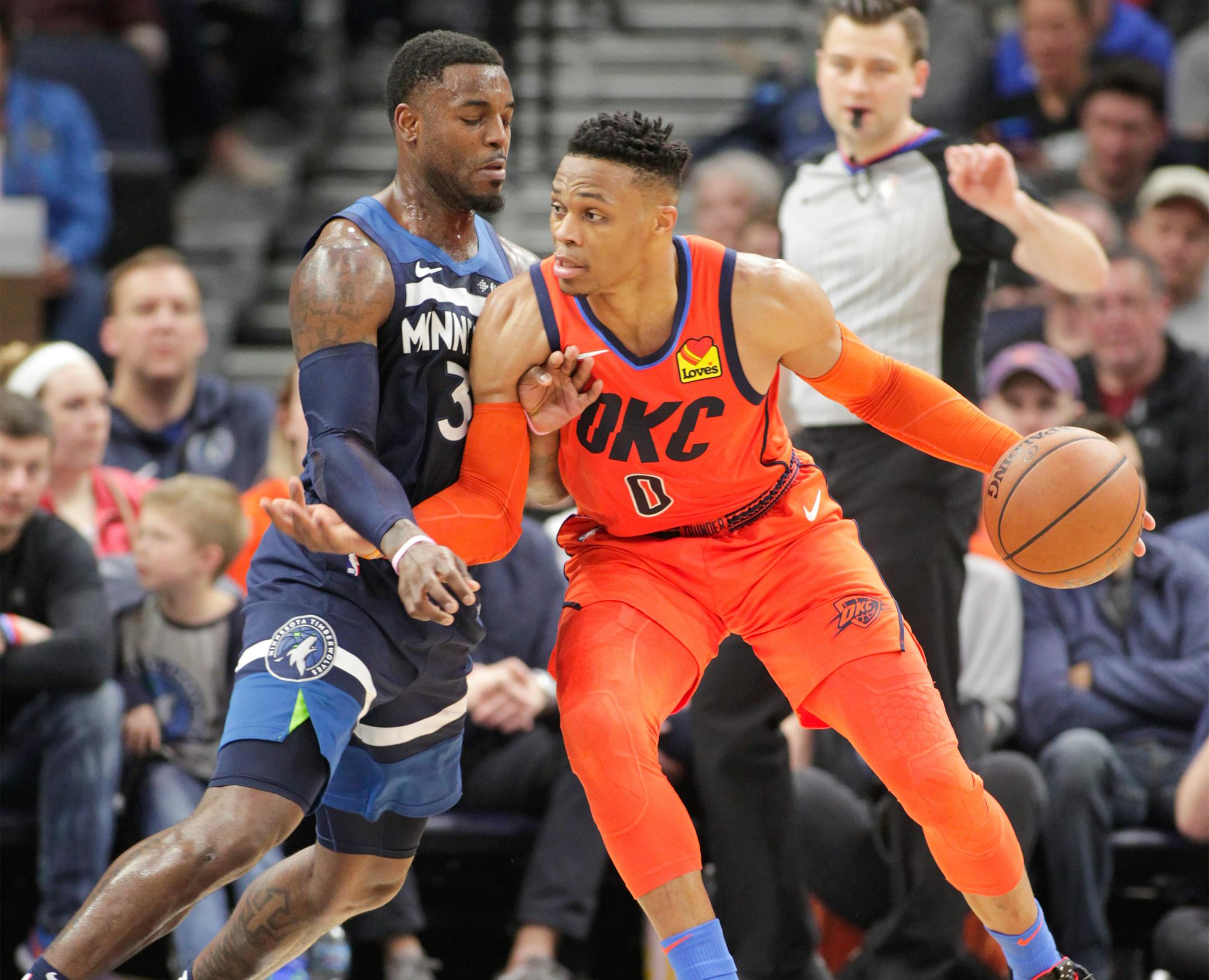 Oklahoma City Thunder guard Russell Westbrook drives against Timberwolves guard Jared Terrell
