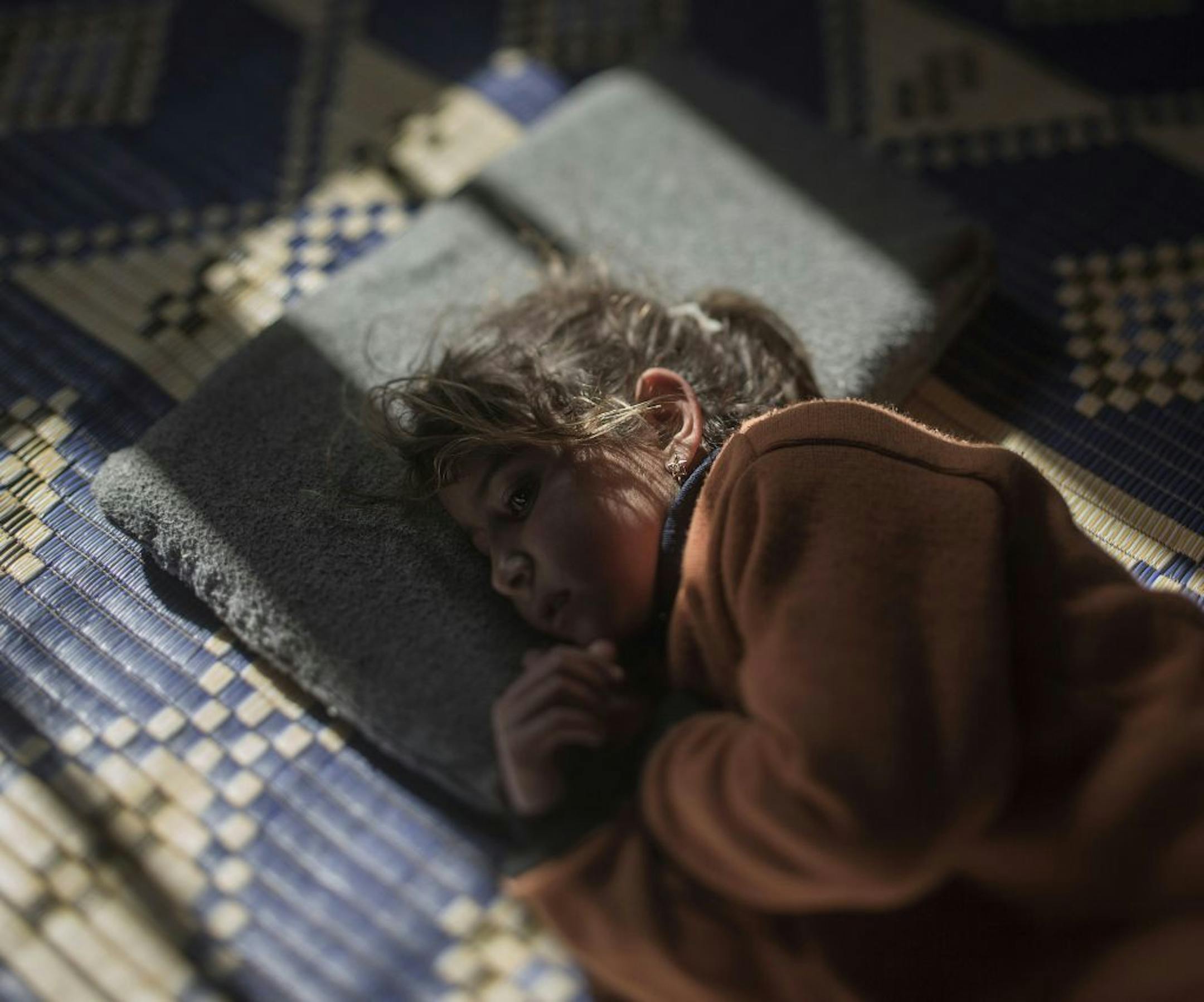 One child misses her bed. Another misses her dark-eyed doll. A third dreams of the old days, when her pillow didn�t feel like an enemy. Two million children have fled Syria. Leaving behind their friends, their homes, their beds. A dozen of these children have invited us to come and see where they now sleep, now that everything they once had is gone. Tamam, 5 AZRAQ (Jordan). Five-year-old Tamam is scared of her pillow. She cries every night at bedtime. The air raids on her hometown of Homs usuall