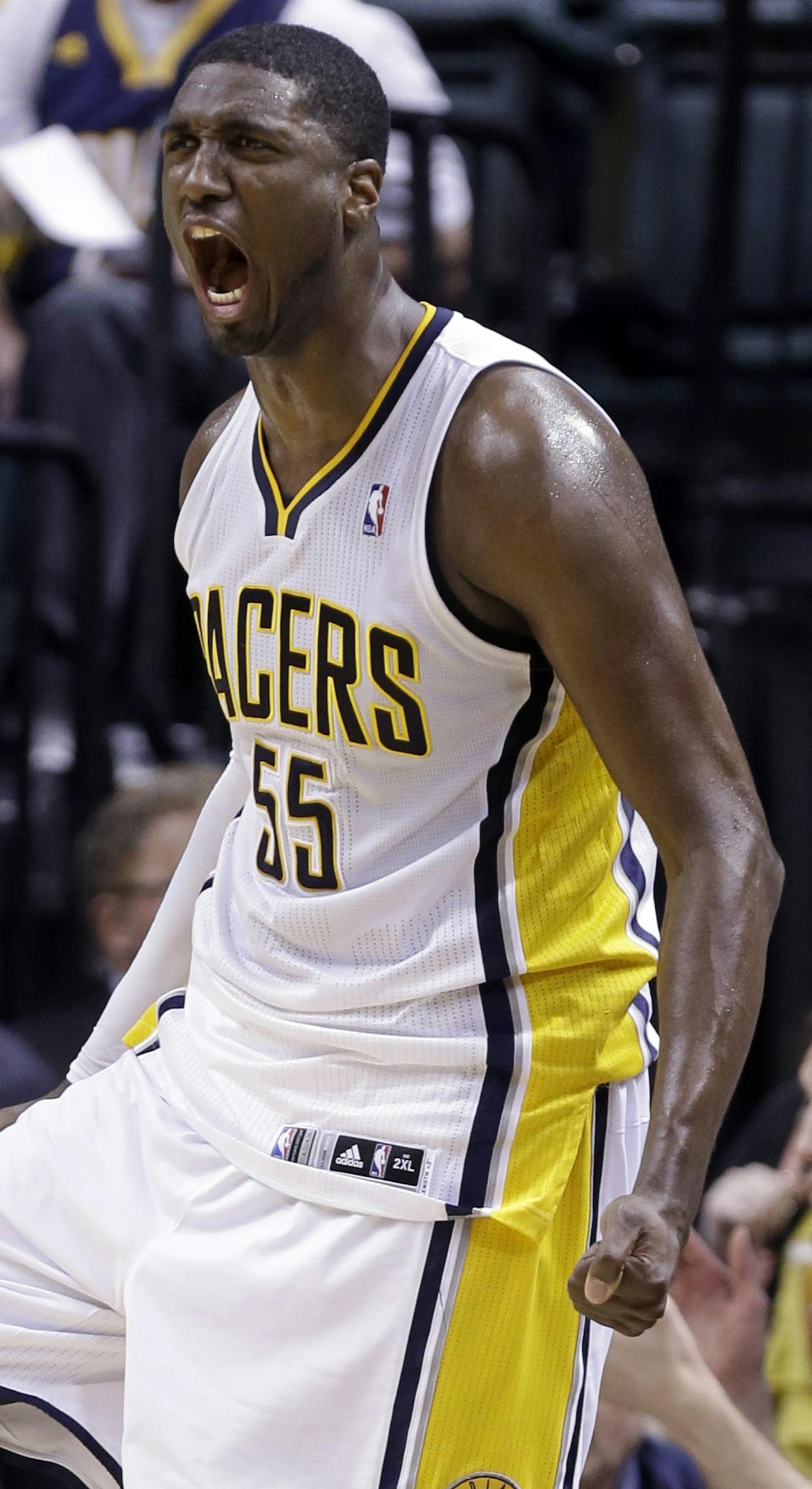 Indiana Pacers center Roy Hibbert celebrates on the bench in the second half of an NBA basketball game against the Minnesota Timberwolves in Indianapolis, Wednesday, March 13, 2013. The Pacers defeated the Timberwolves 107-91. (AP Photo/Michael Conroy)