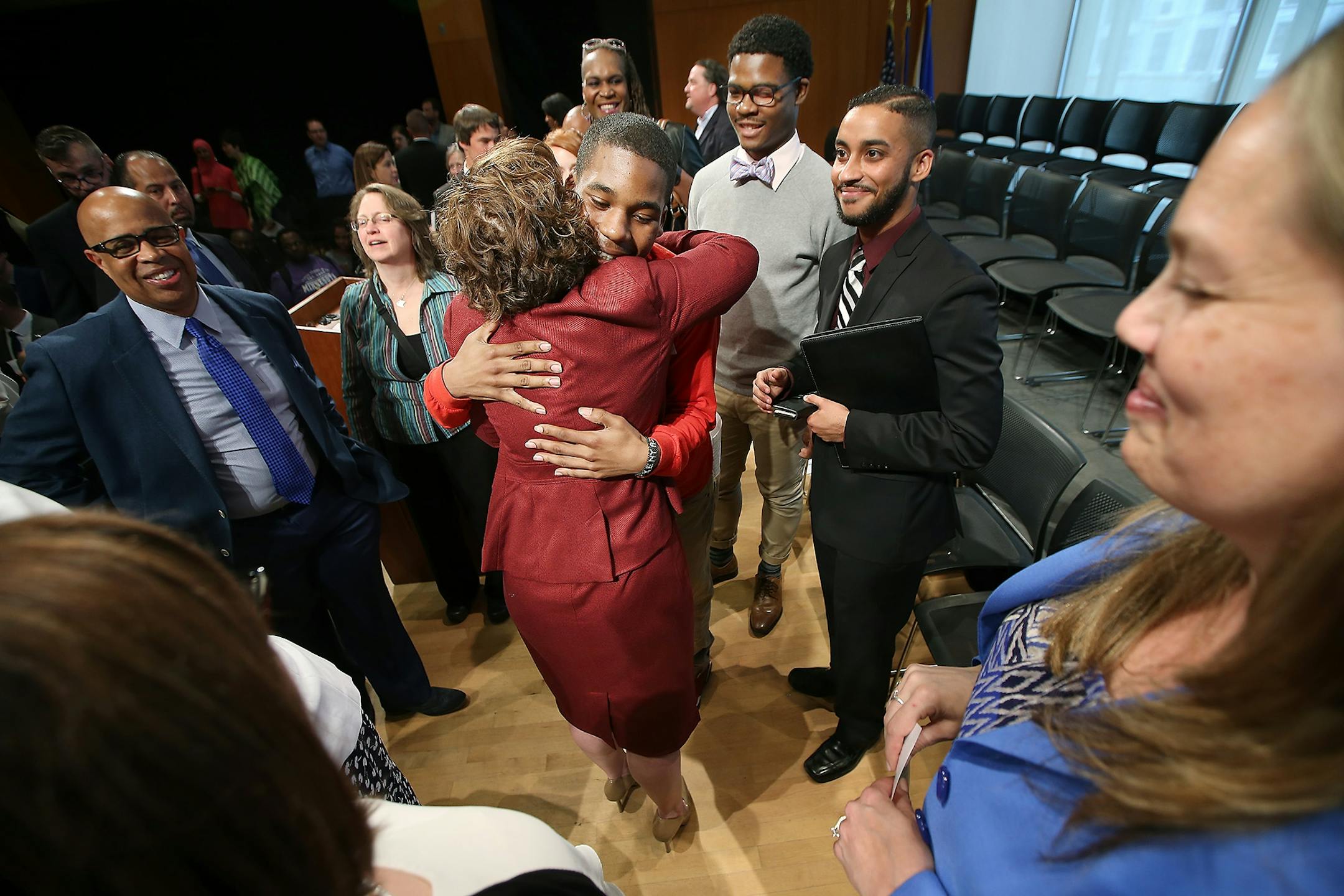 Minneapolis Mayor Betsy Hodges received a hug from BUILD Leaders alumni, Isaiah Hudson, whom she recognized during her 2016 State of the City Address at the MacPhail Center for Music, Tuesday, May 17, 2016 in Minneapolis, MN.