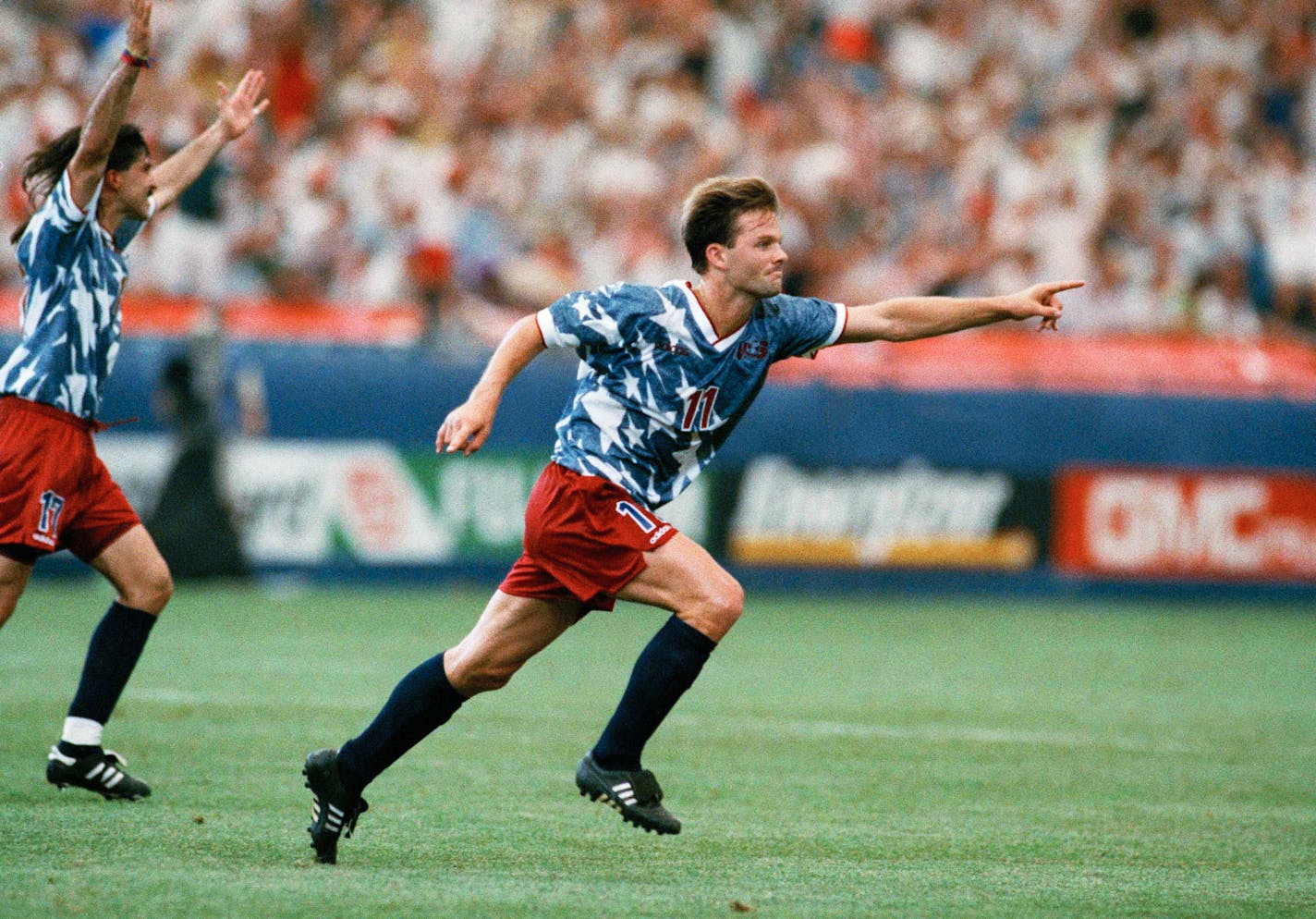 United States forward Eric Wynalda, right, reacts after he scored against Switzerland in a World Cup Group A first-round match at the Pontiac Silverdome on Saturday, June 18, 1994.