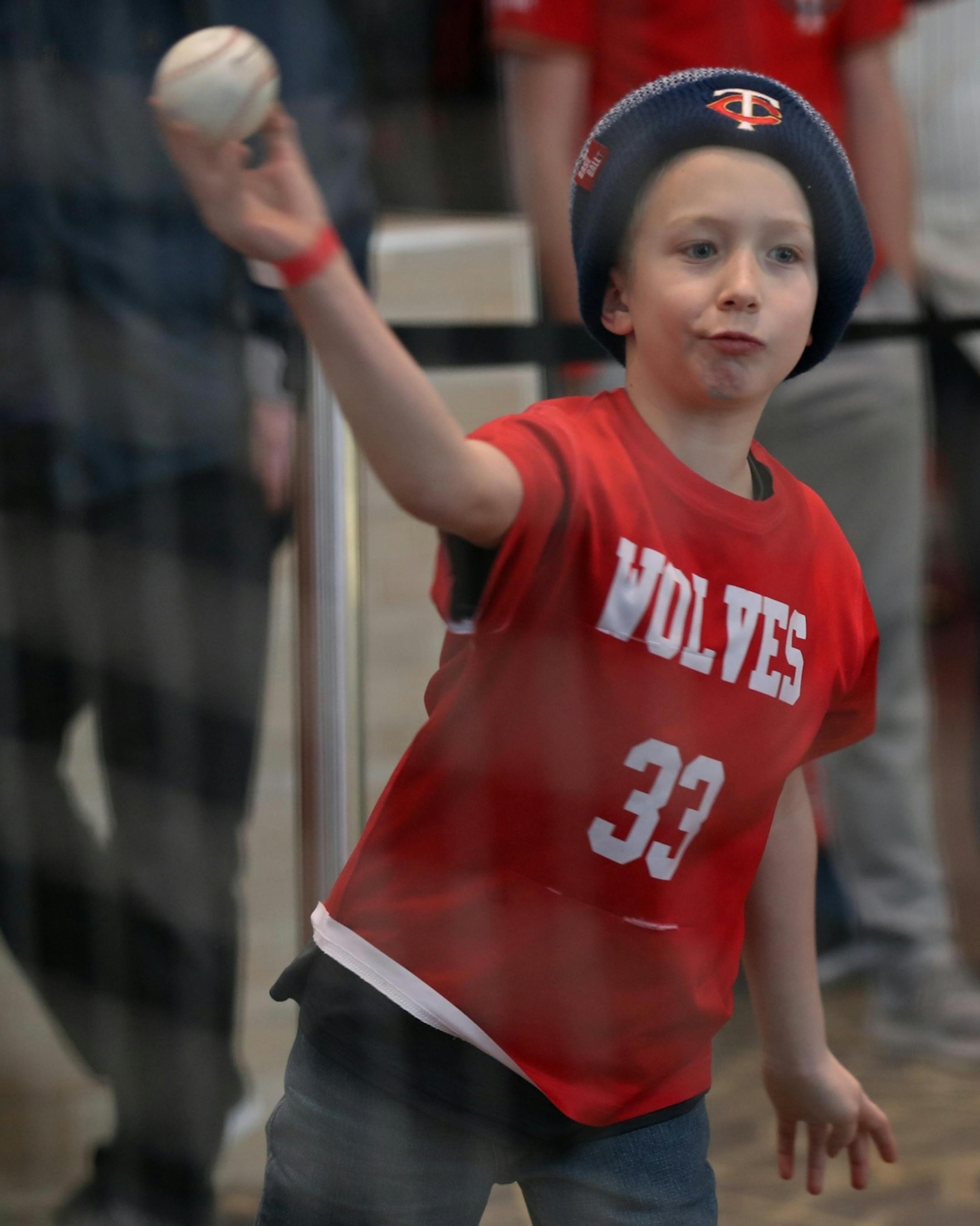 A youngster tried his hand at the speed pitch booth at TwinsFest.