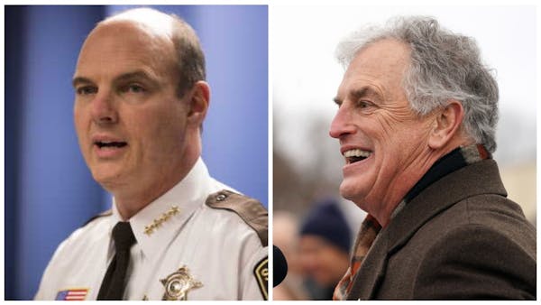 Outgoing Hennepin County Sheriff Rich Stanek and Commissioner Peter McLaughlin.