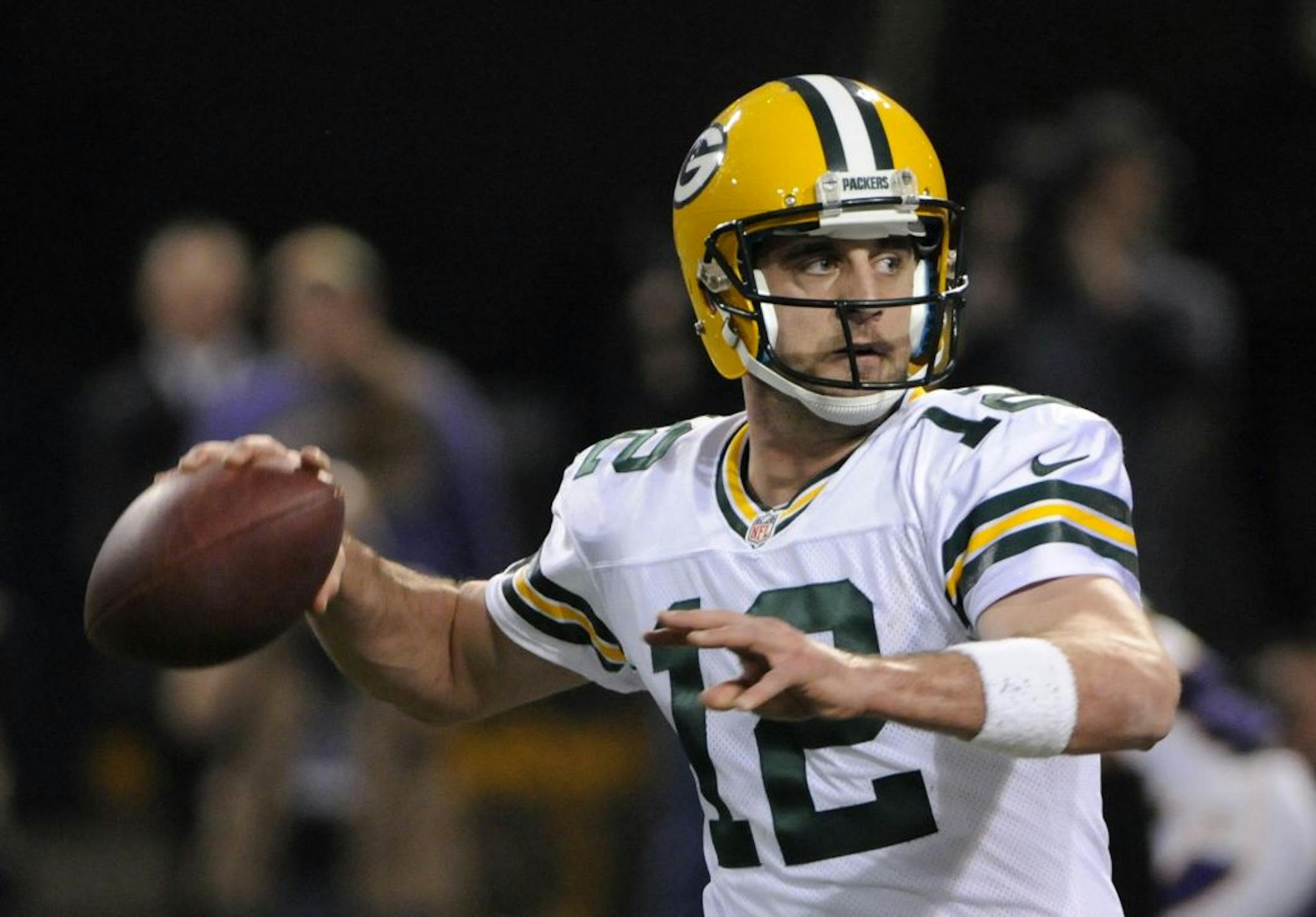 Green Bay Packers quarterback Aaron Rodgers throws a pass during the second half of an NFL football game against the Minnesota Vikings Sunday, Dec. 30, 2012, in Minneapolis.