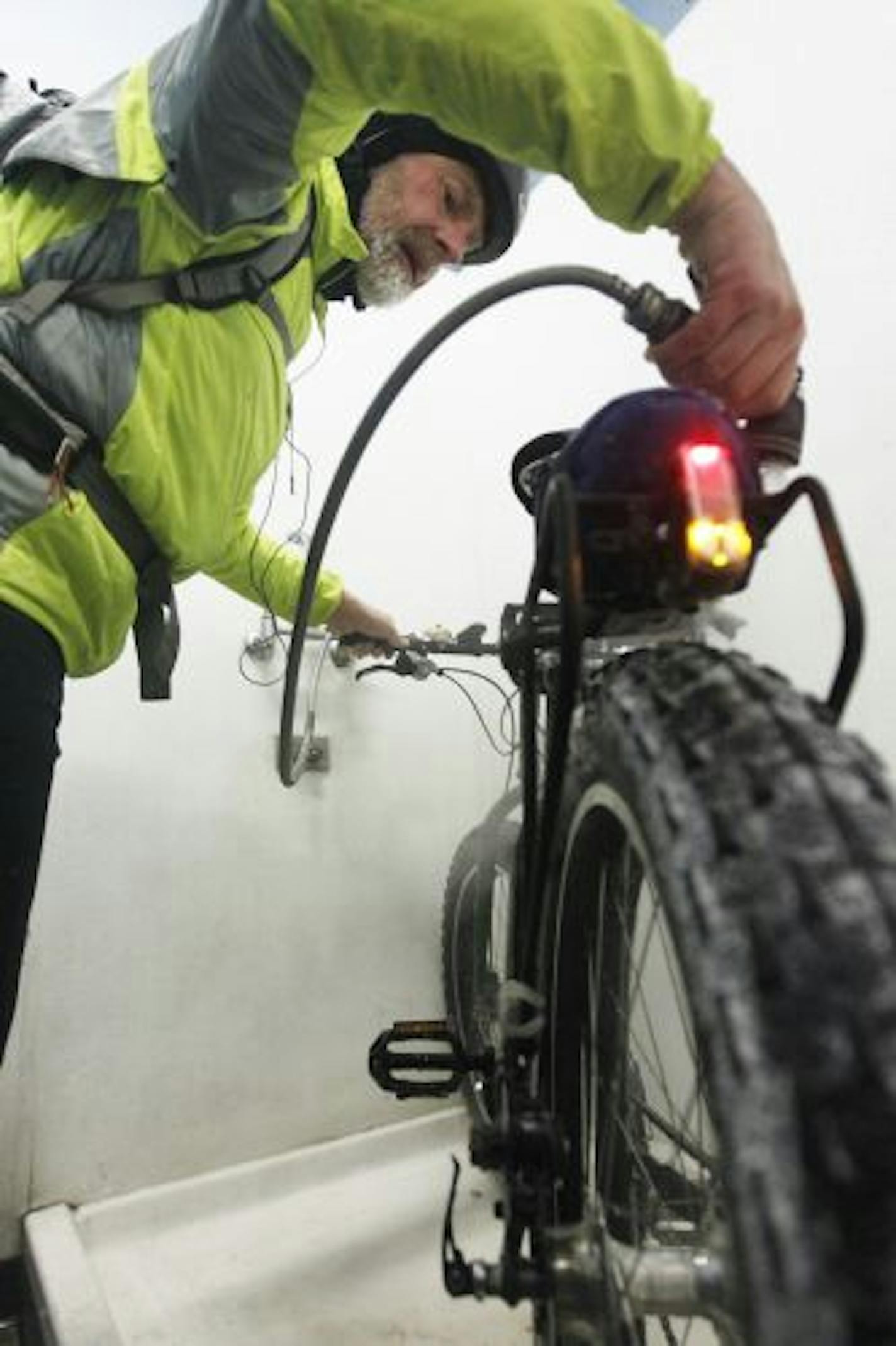 At the Freewheel Midtown Bike Center, Tom Lais washes his bike to get the salt off.