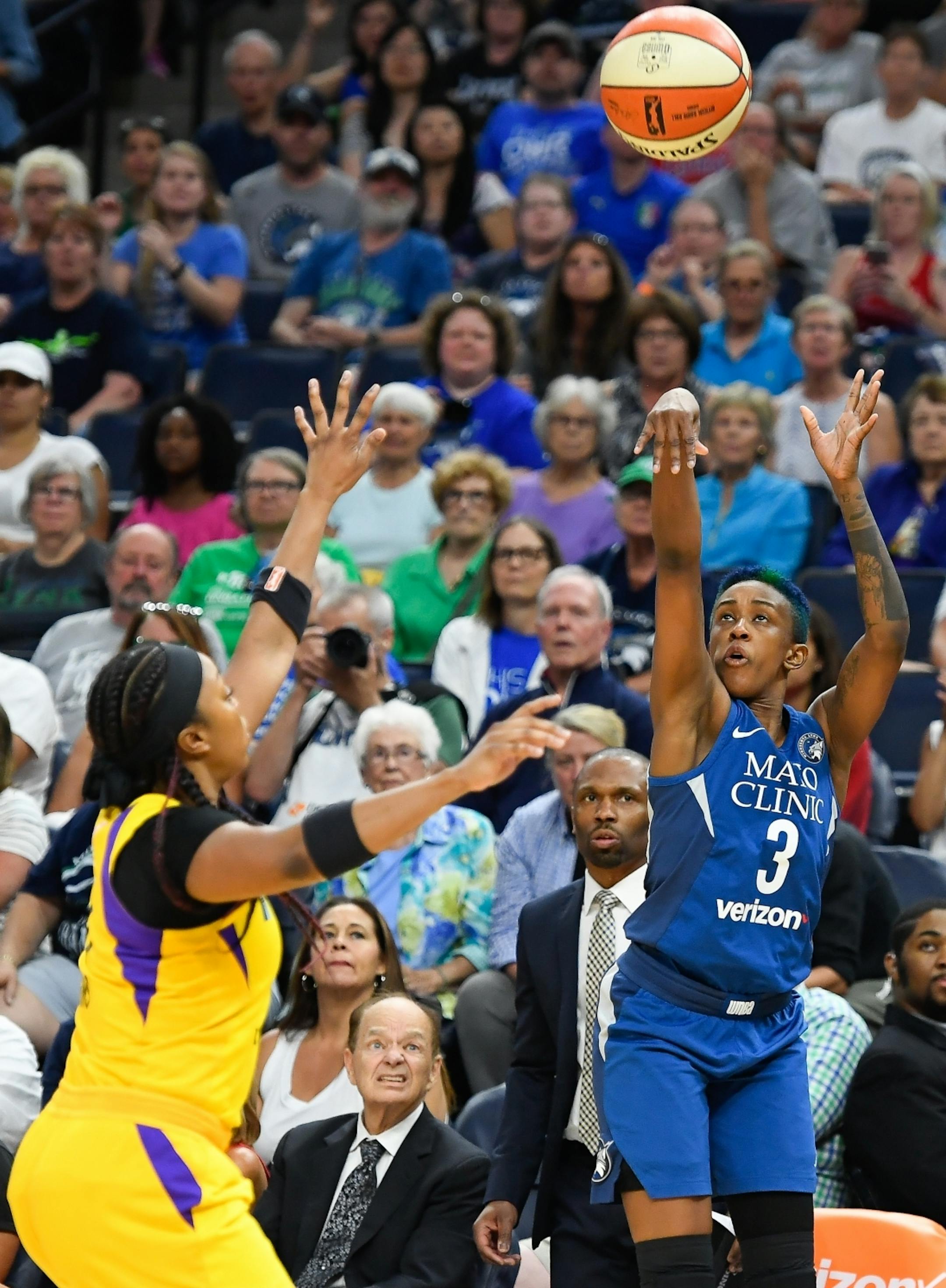 Los Angeles Sparks guard Odyssey Sims (1) was unable to stop a 3-point basket by Minnesota Lynx guard Danielle Robinson (3) in the second half.